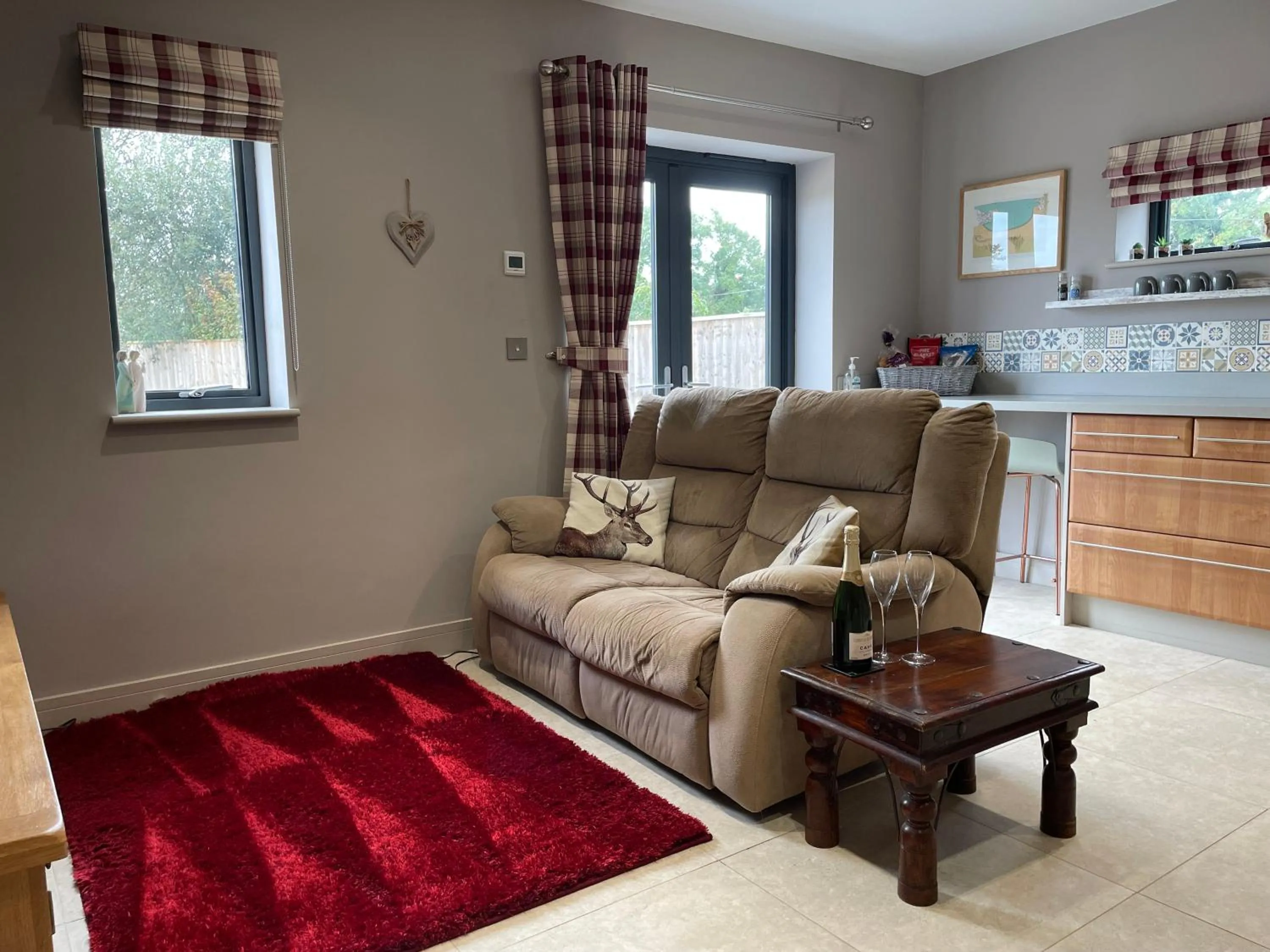 Living room in The Paddocks - Spacious annexe with rural outlook.