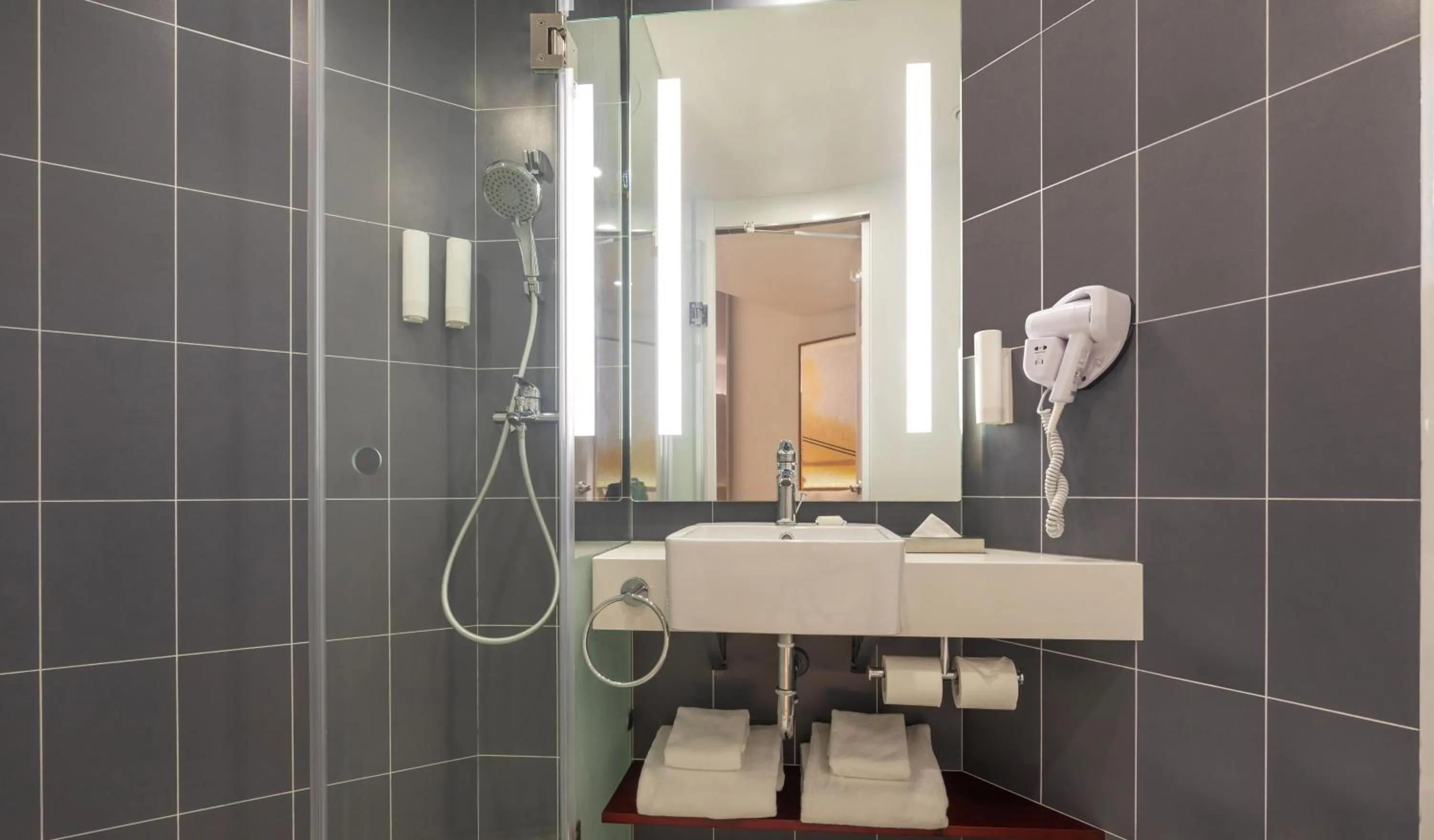 Bathroom in ibis Thane - An Accor Brand