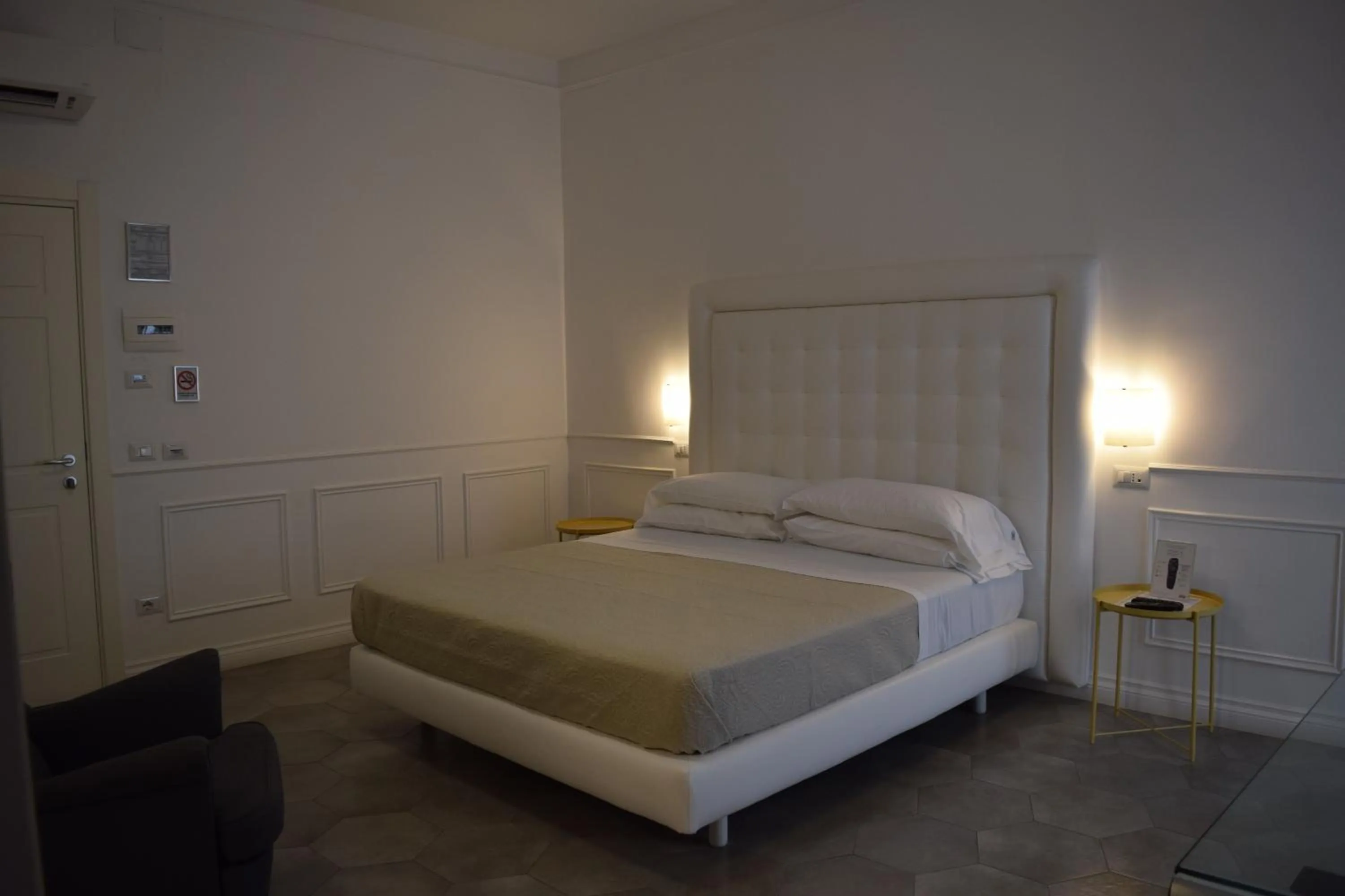 Bed in RAVIDA SUITES