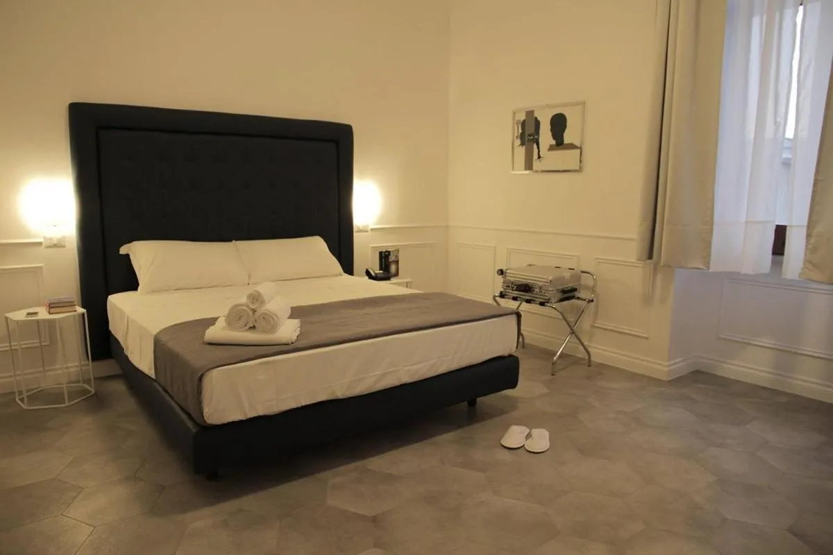 Bed in RAVIDA SUITES