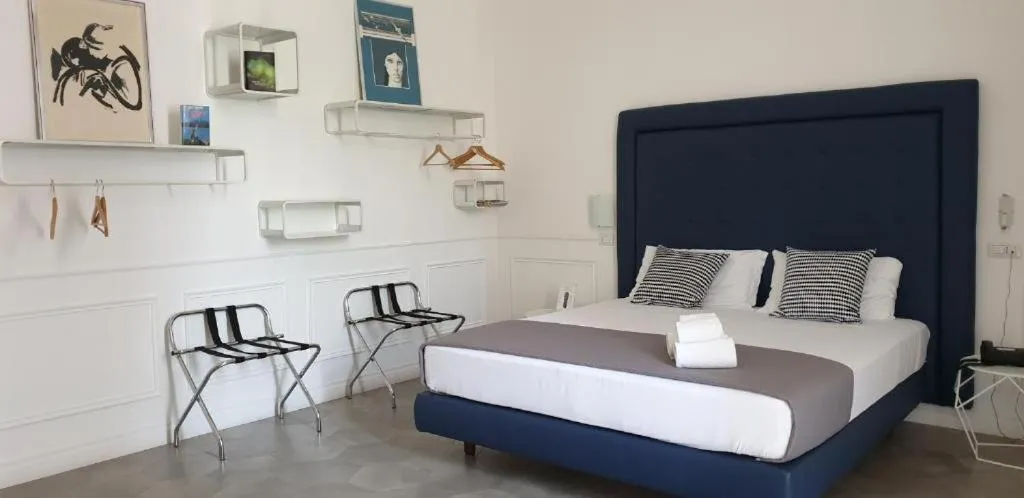 Bed in RAVIDA SUITES