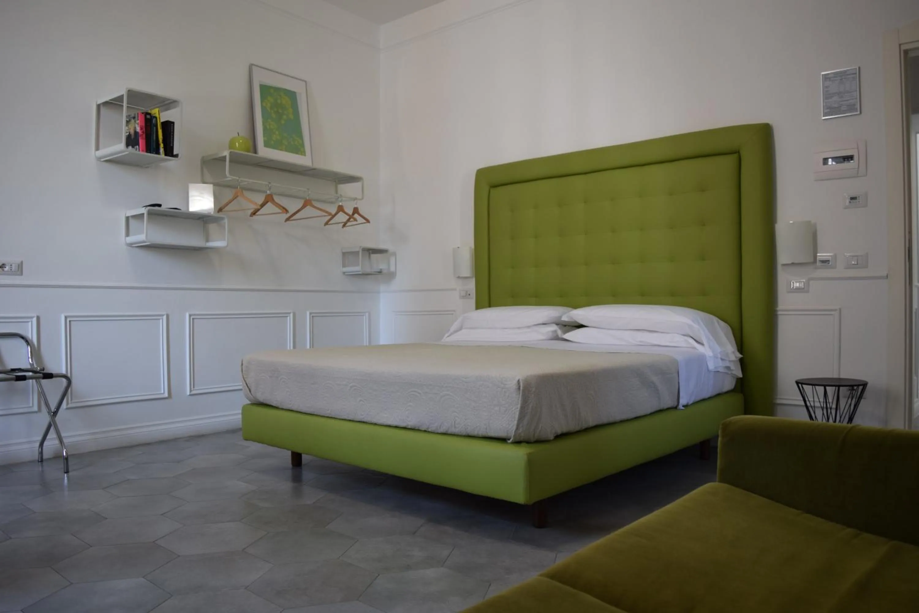 Bed in RAVIDA SUITES