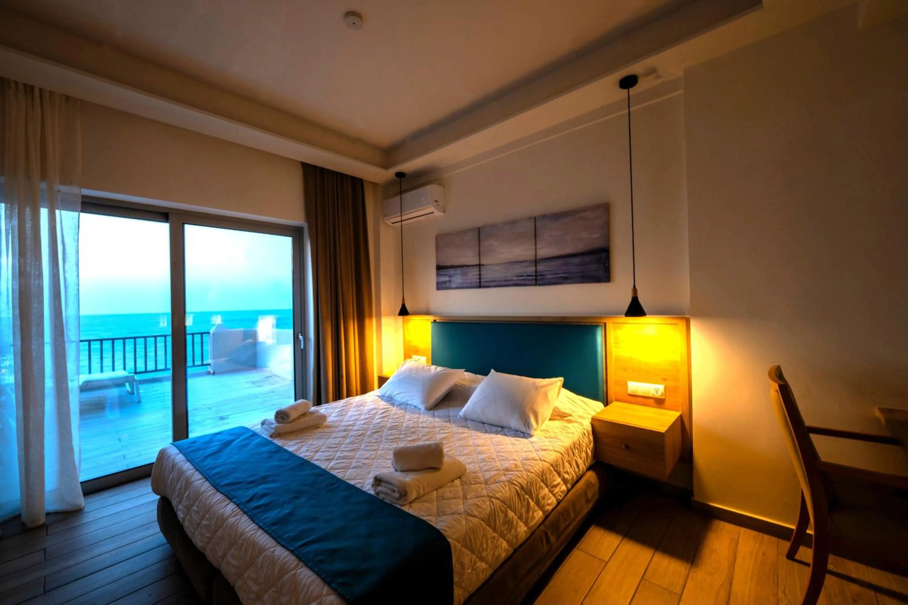 Bed in Cavos Bay Hotel & Studios