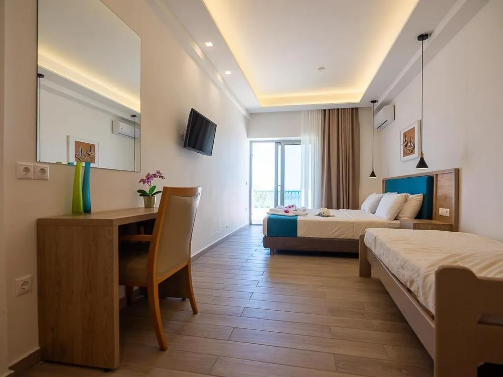 Bed in Cavos Bay Hotel & Studios