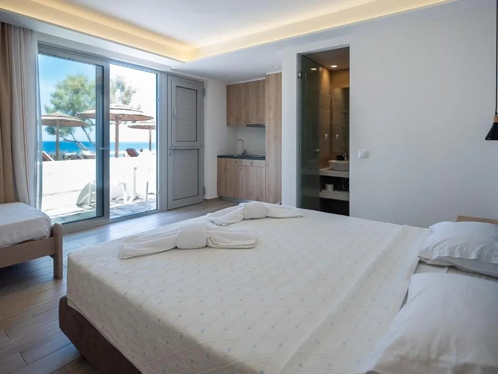 Bed in Cavos Bay Hotel & Studios