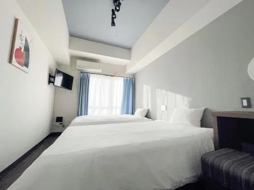 Photo of the whole room, Bed in JC HOTEL NaHa
