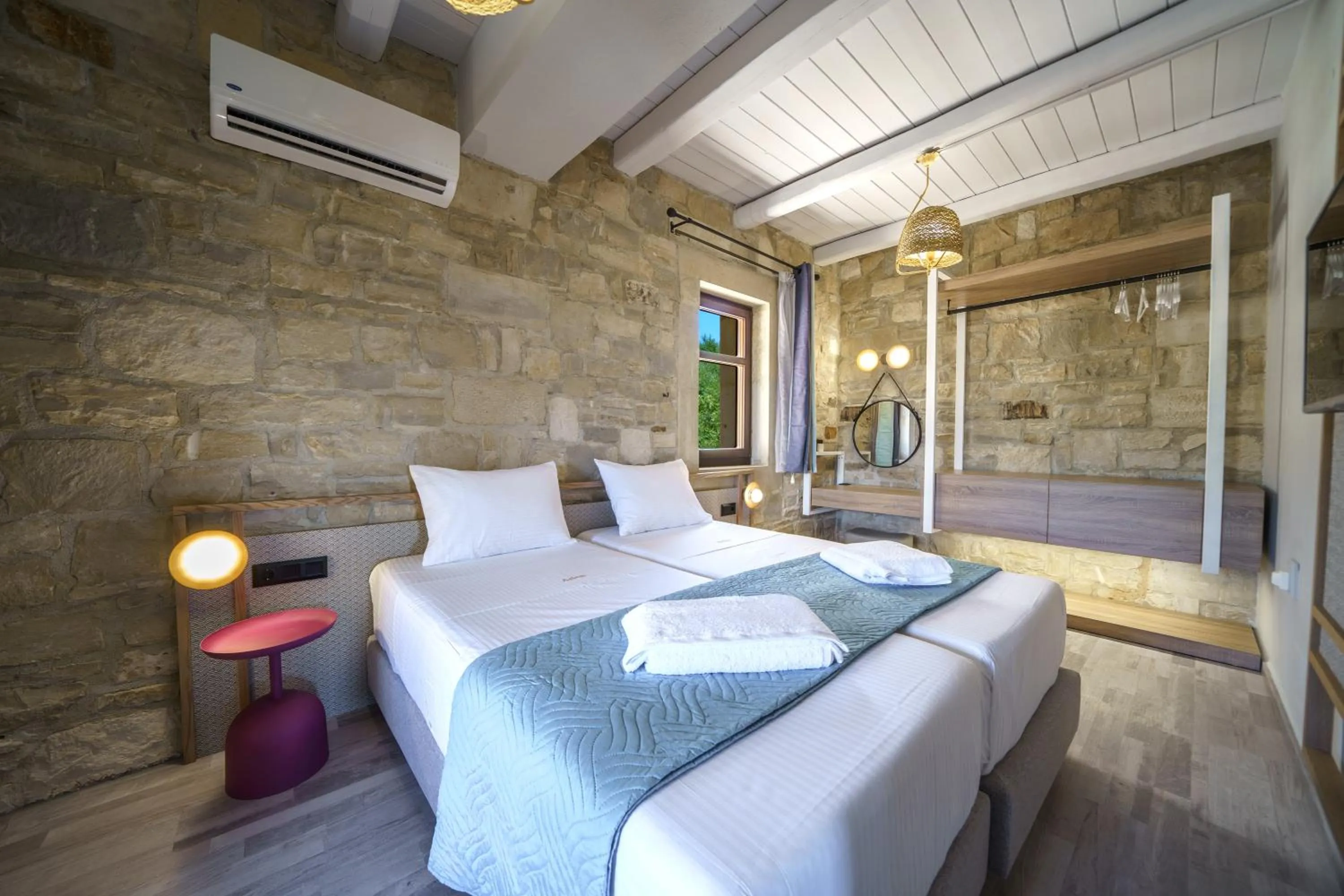 Bedroom in Asion Lithos Suites with Private Pools