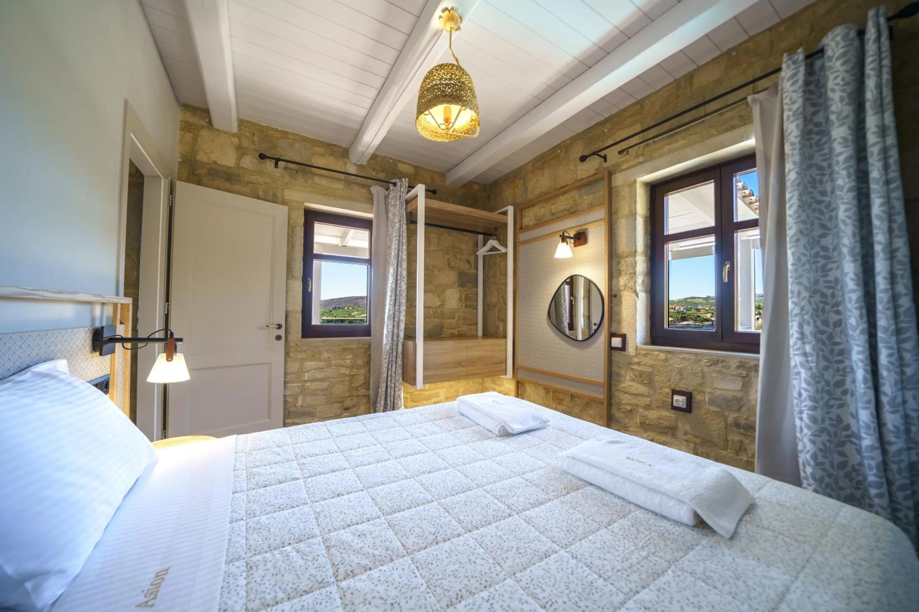 Bedroom in Asion Lithos Suites with Private Pools