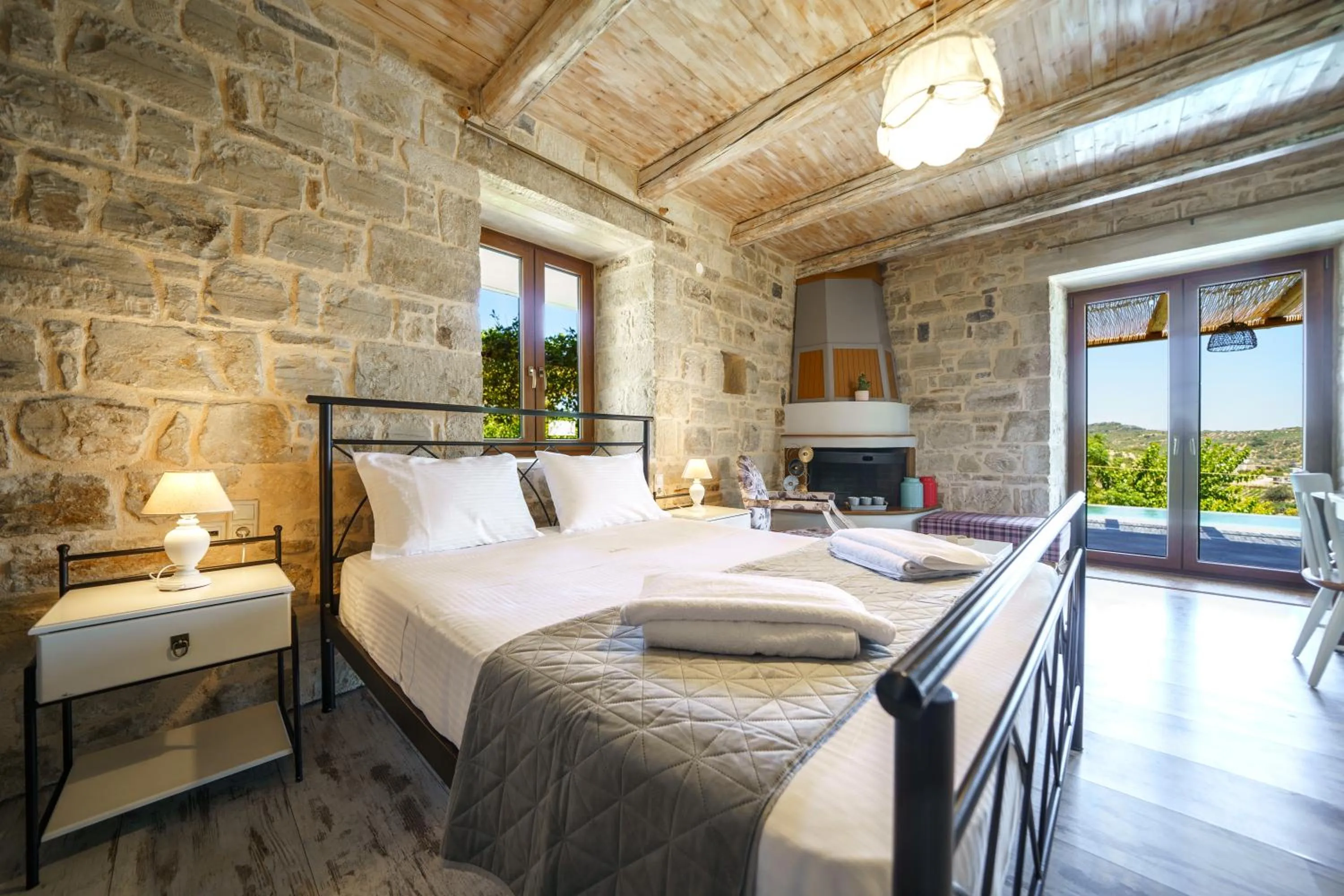 Bed in Asion Lithos Suites with Private Pools