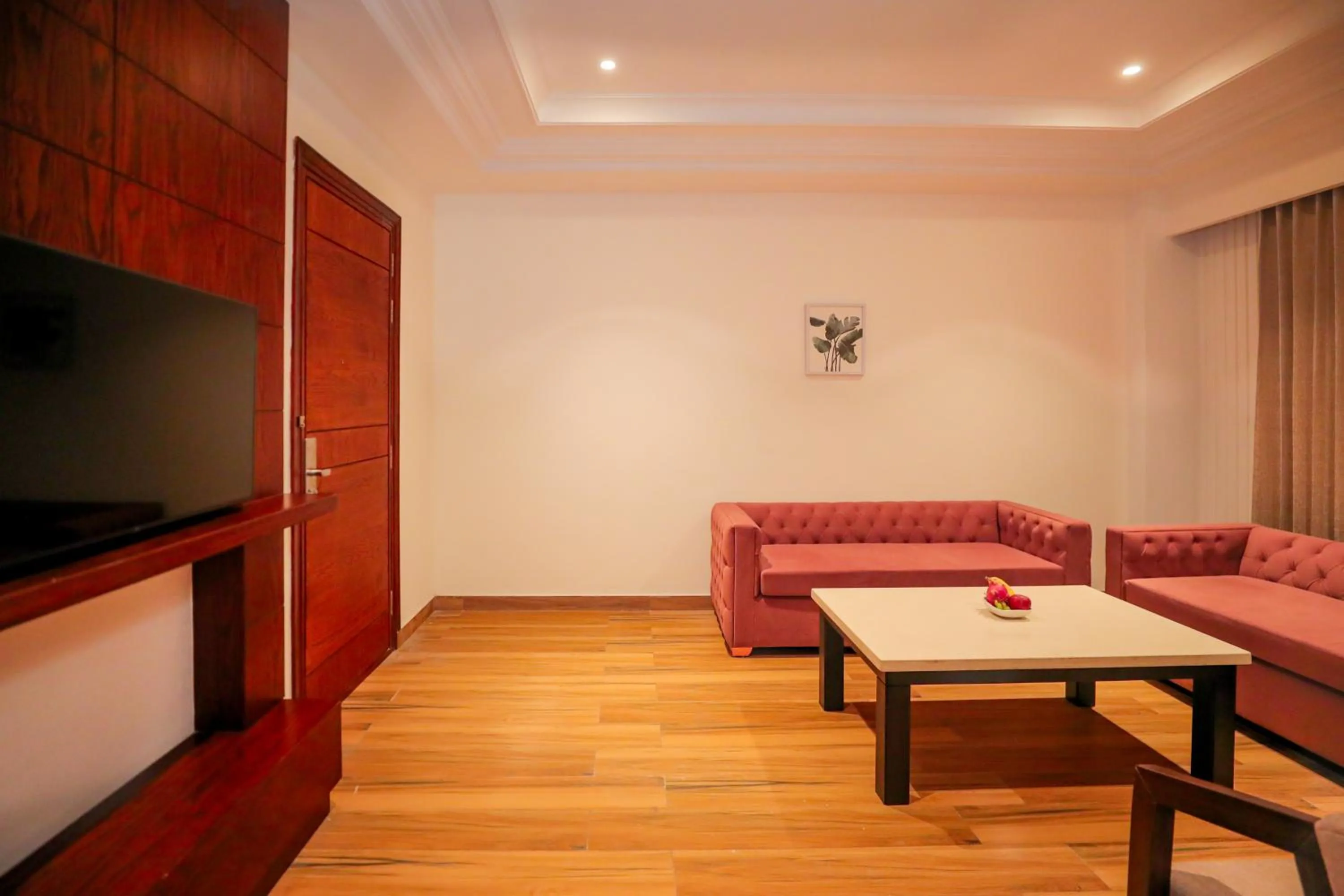 Communal lounge/ TV room in Regenta Place Phagwara by Royal Orchid Hotels Limited