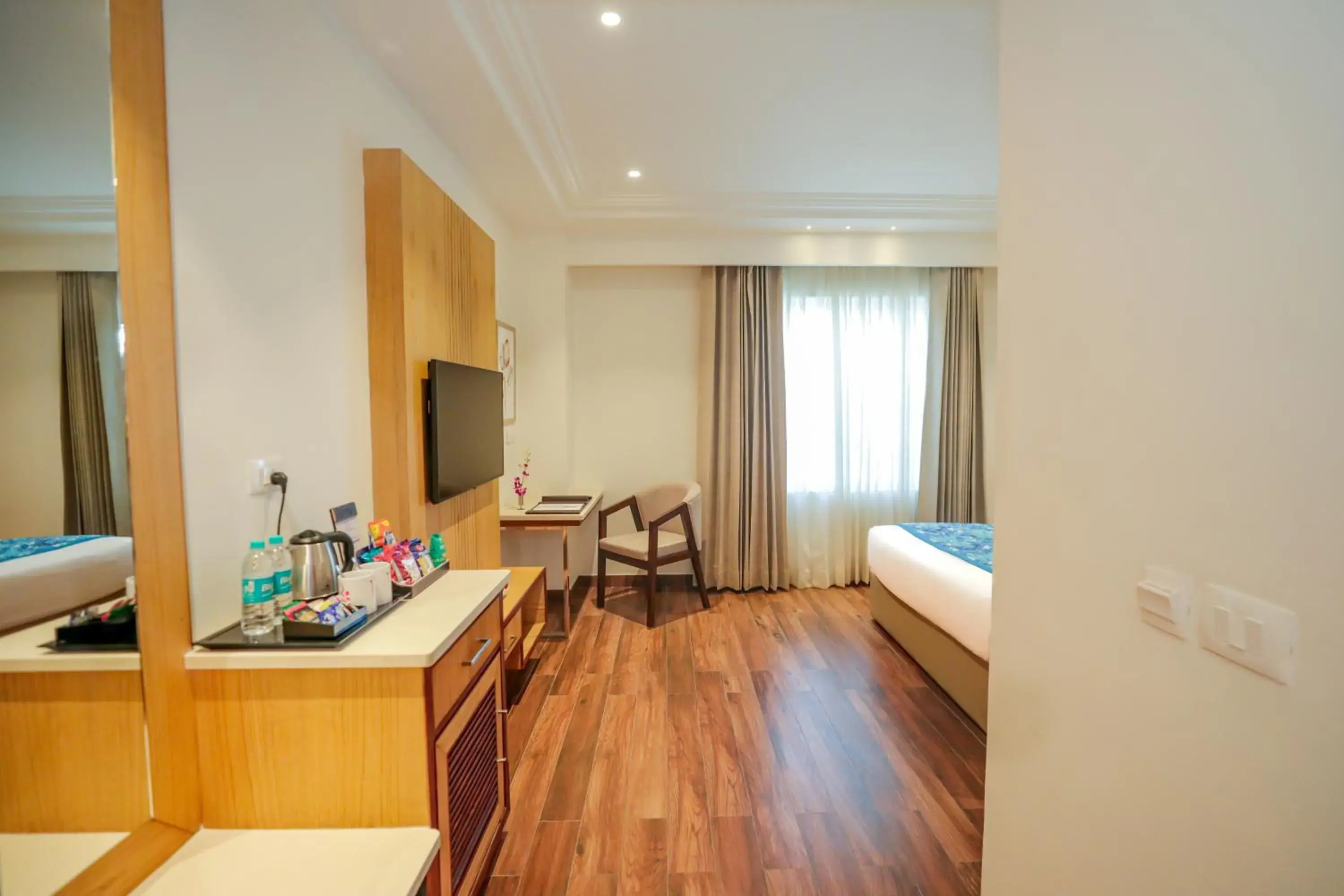 TV and multimedia, Bed in Regenta Place Phagwara by Royal Orchid Hotels Limited TV and multimedia, Bed in Regenta Place Phagwara by Royal Orchid Hotels Limited