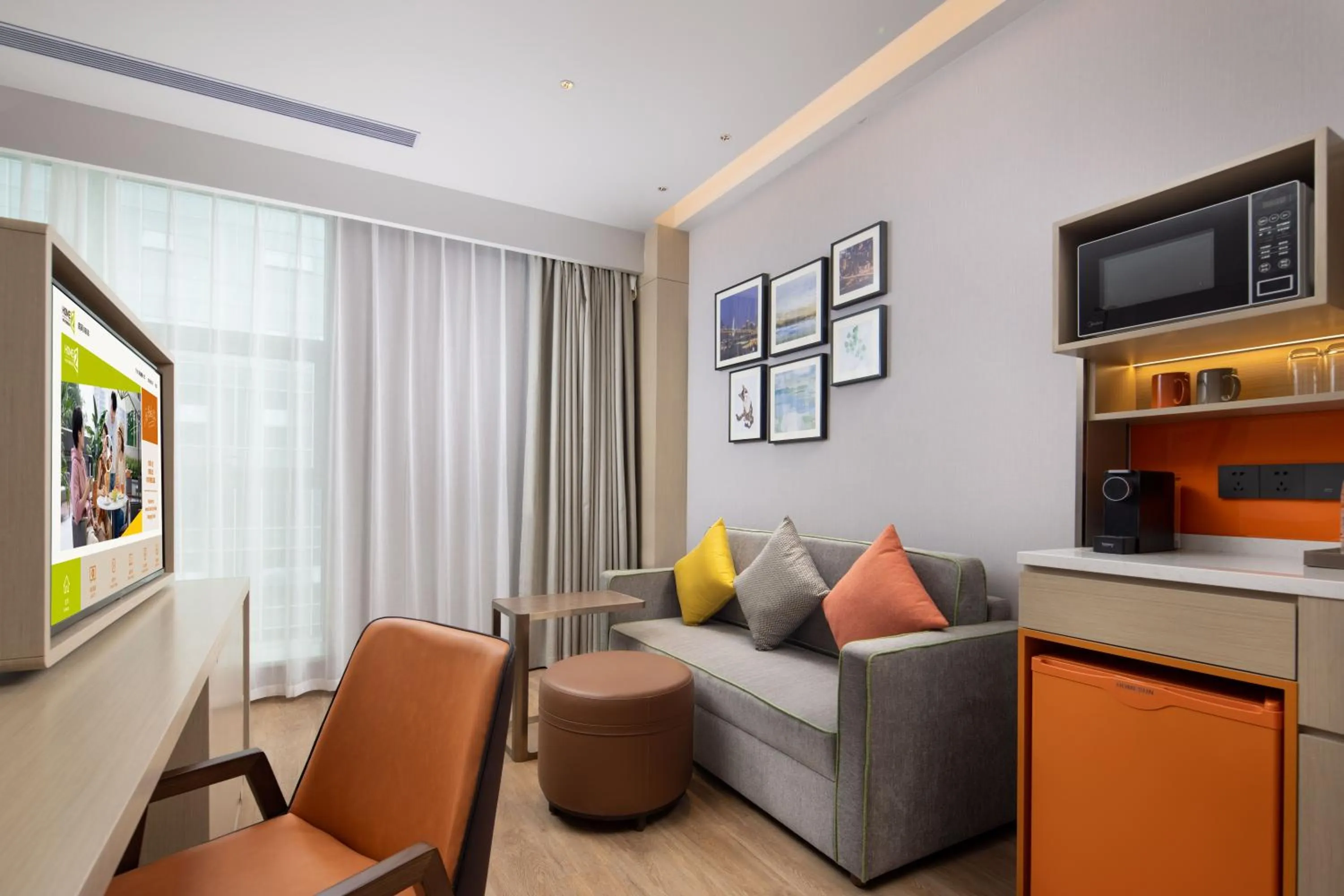 Communal lounge/ TV room in Home2 Suites by Hilton Chongqing Yubei