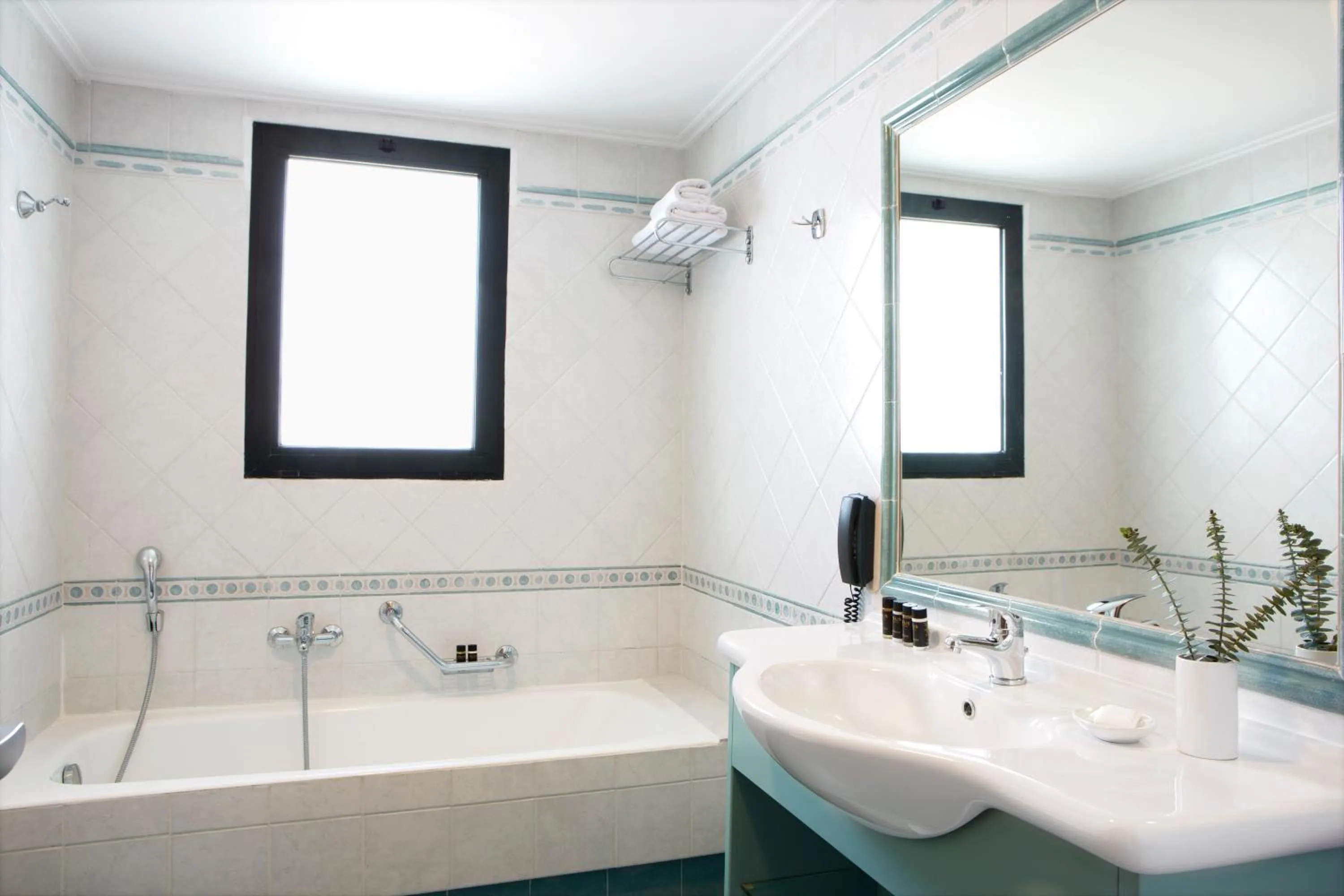 Bathroom in Zeus Essence Ramada by Wyndham Athens