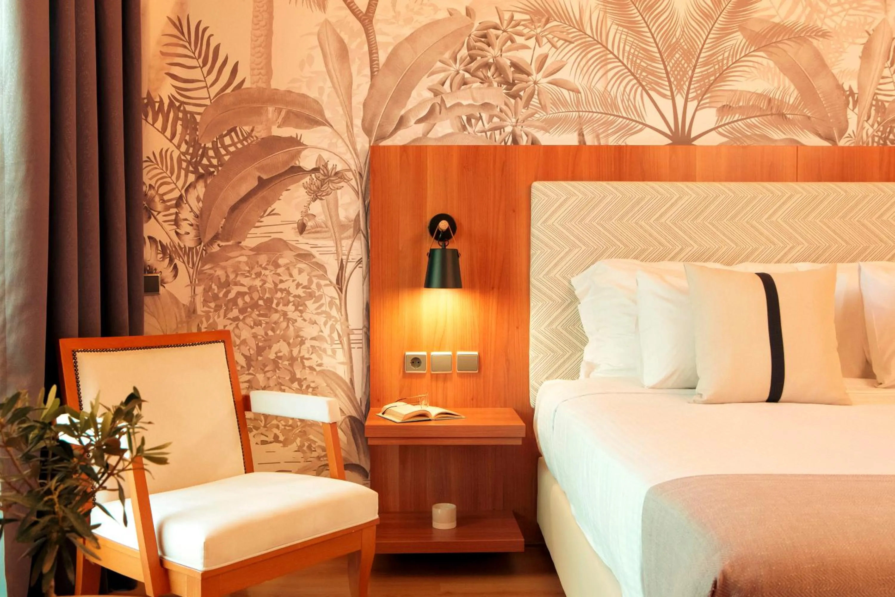 Bed in Zeus Essence Ramada by Wyndham Athens