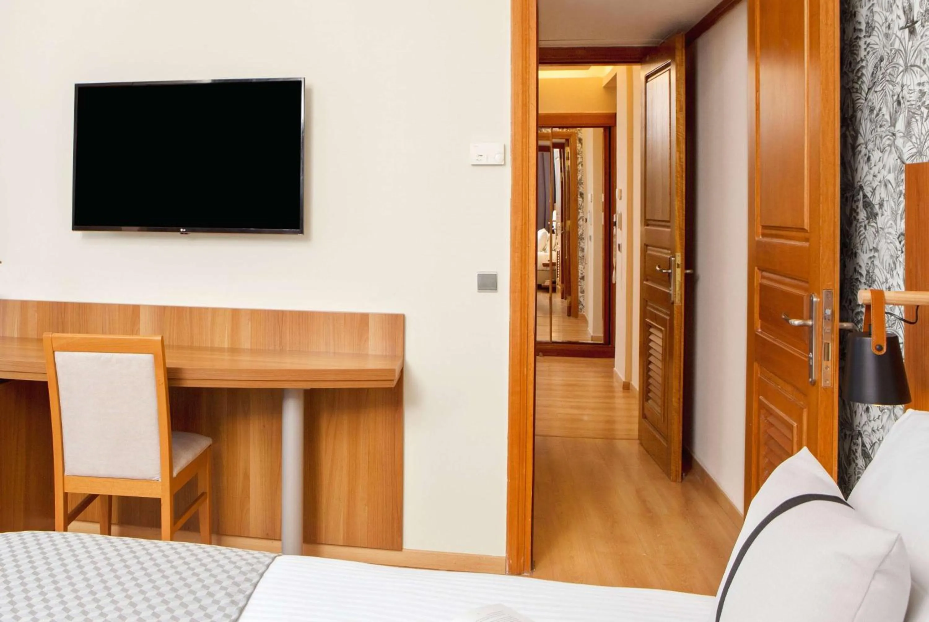 Bed in Zeus Essence Ramada by Wyndham Athens