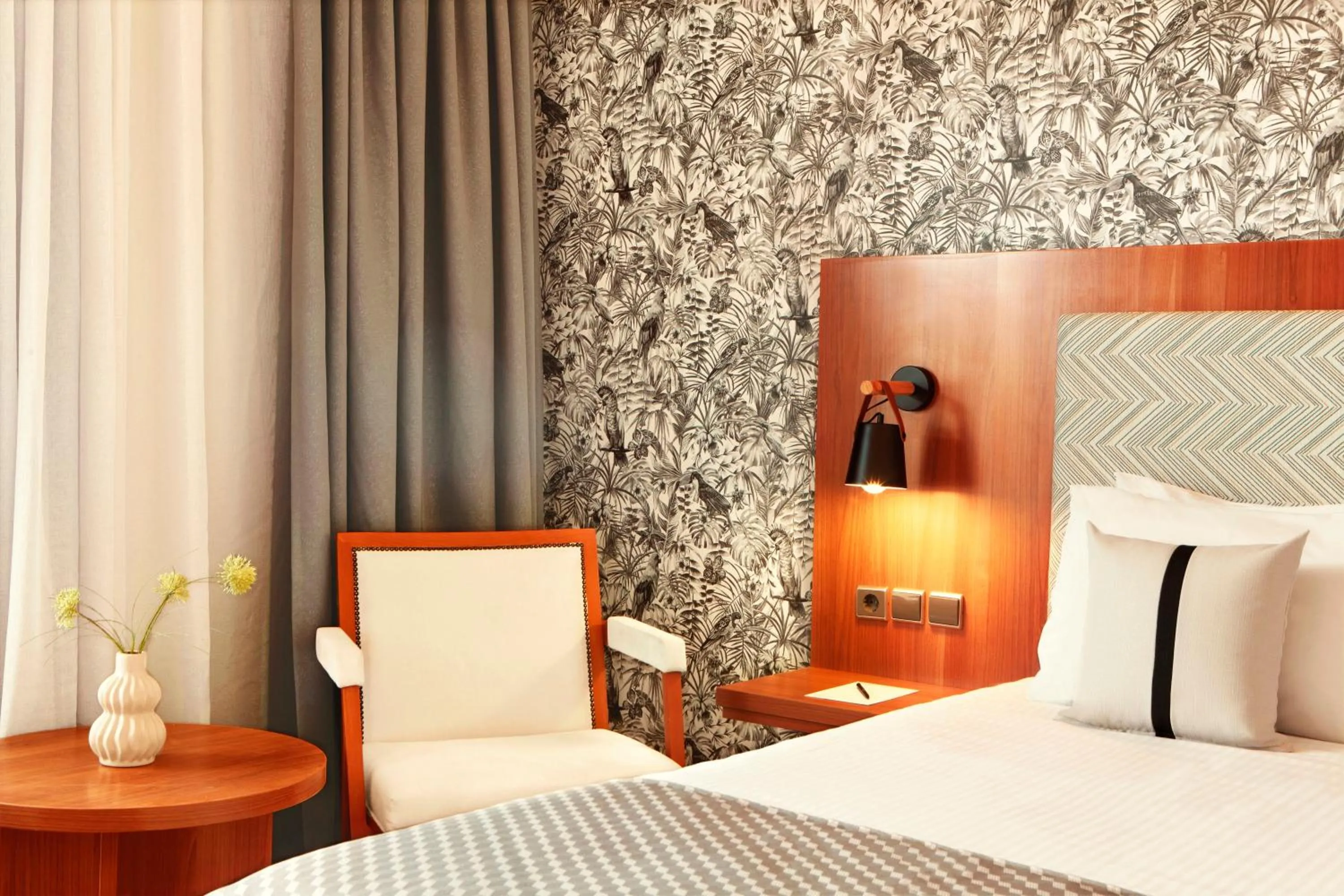 Bed in Zeus Essence Ramada by Wyndham Athens