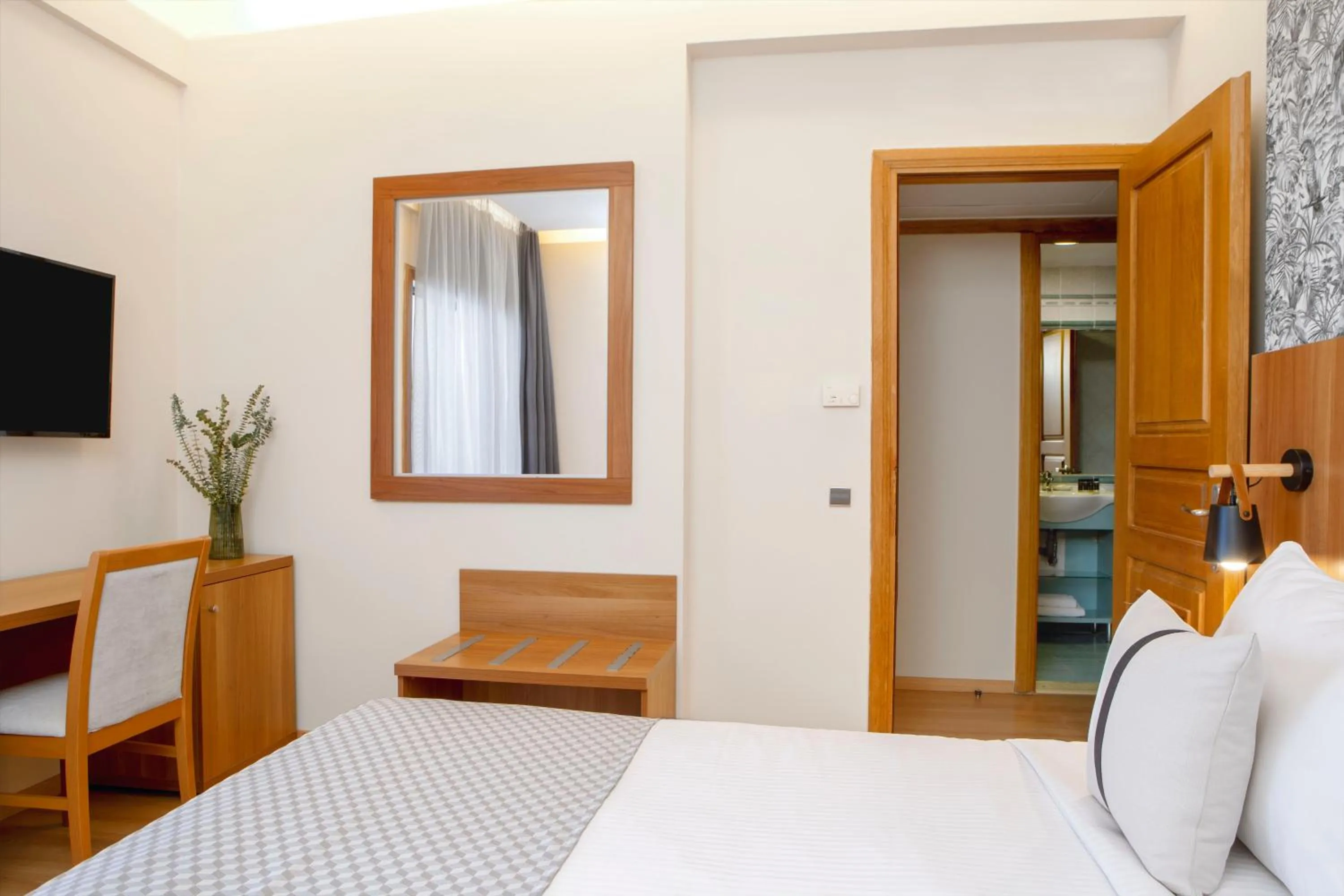 Bed in Zeus Essence Ramada by Wyndham Athens