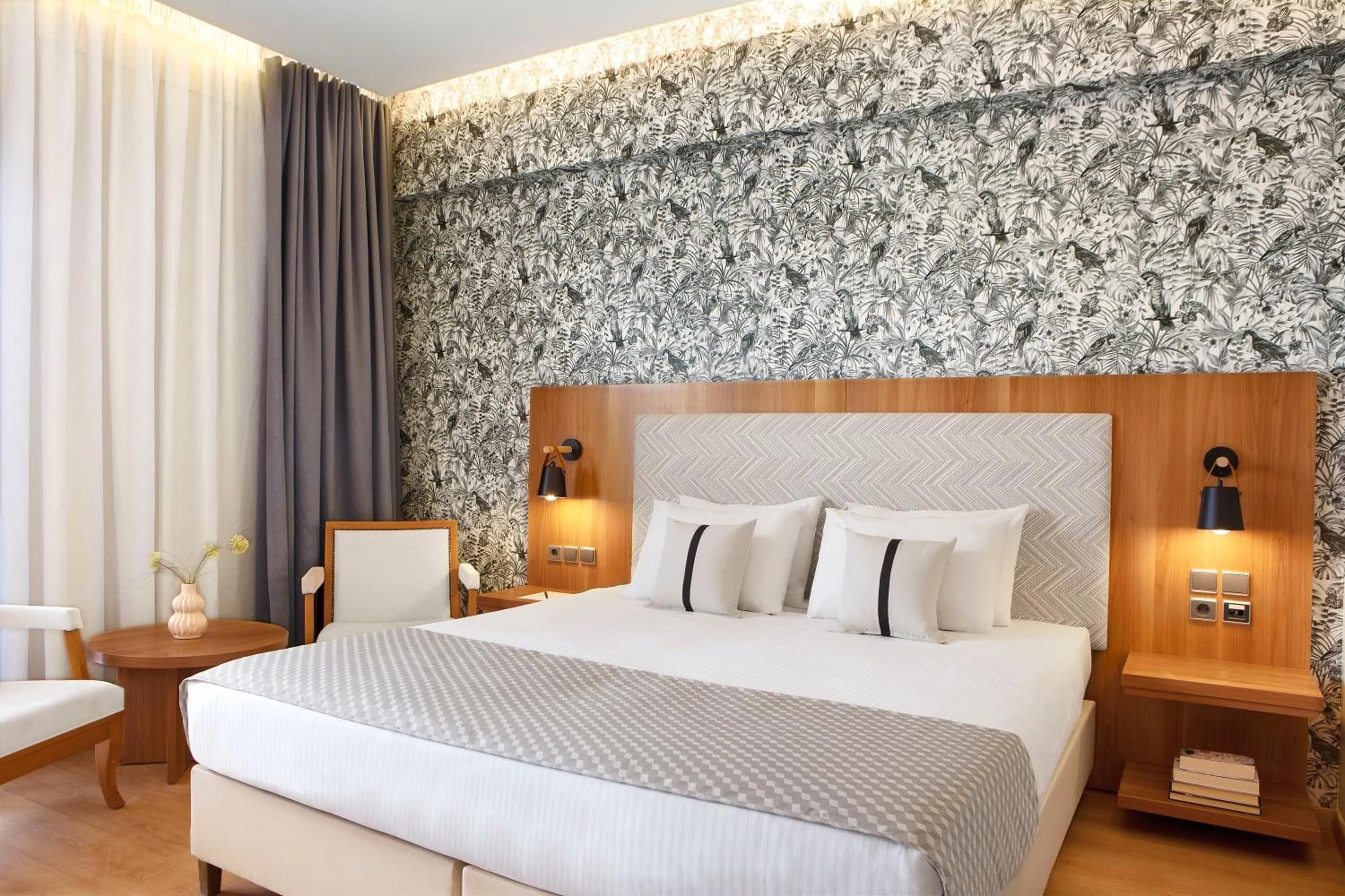 Bed in Zeus Essence Ramada by Wyndham Athens