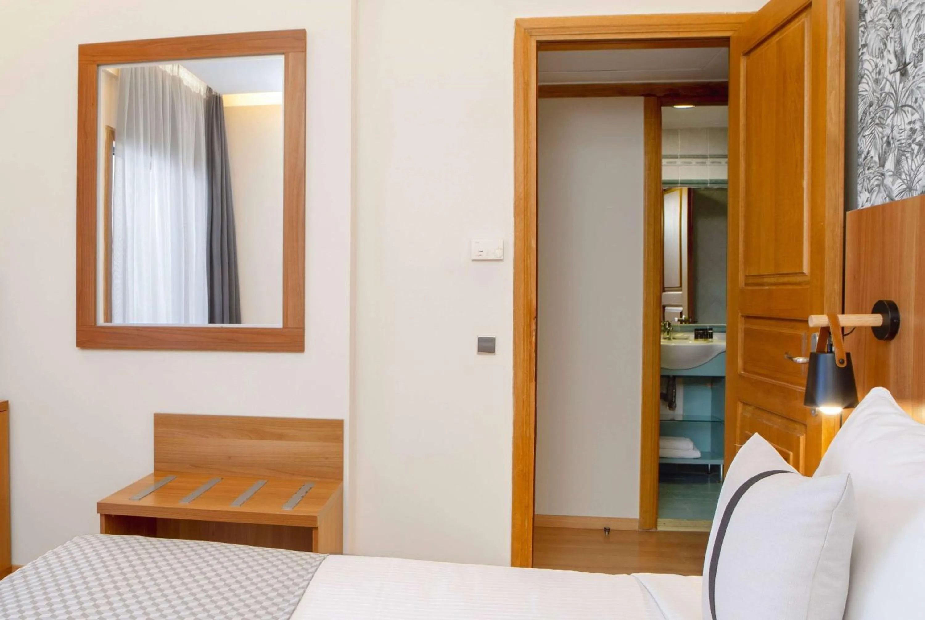 Photo of the whole room, Bed in Zeus Essence Ramada by Wyndham Athens