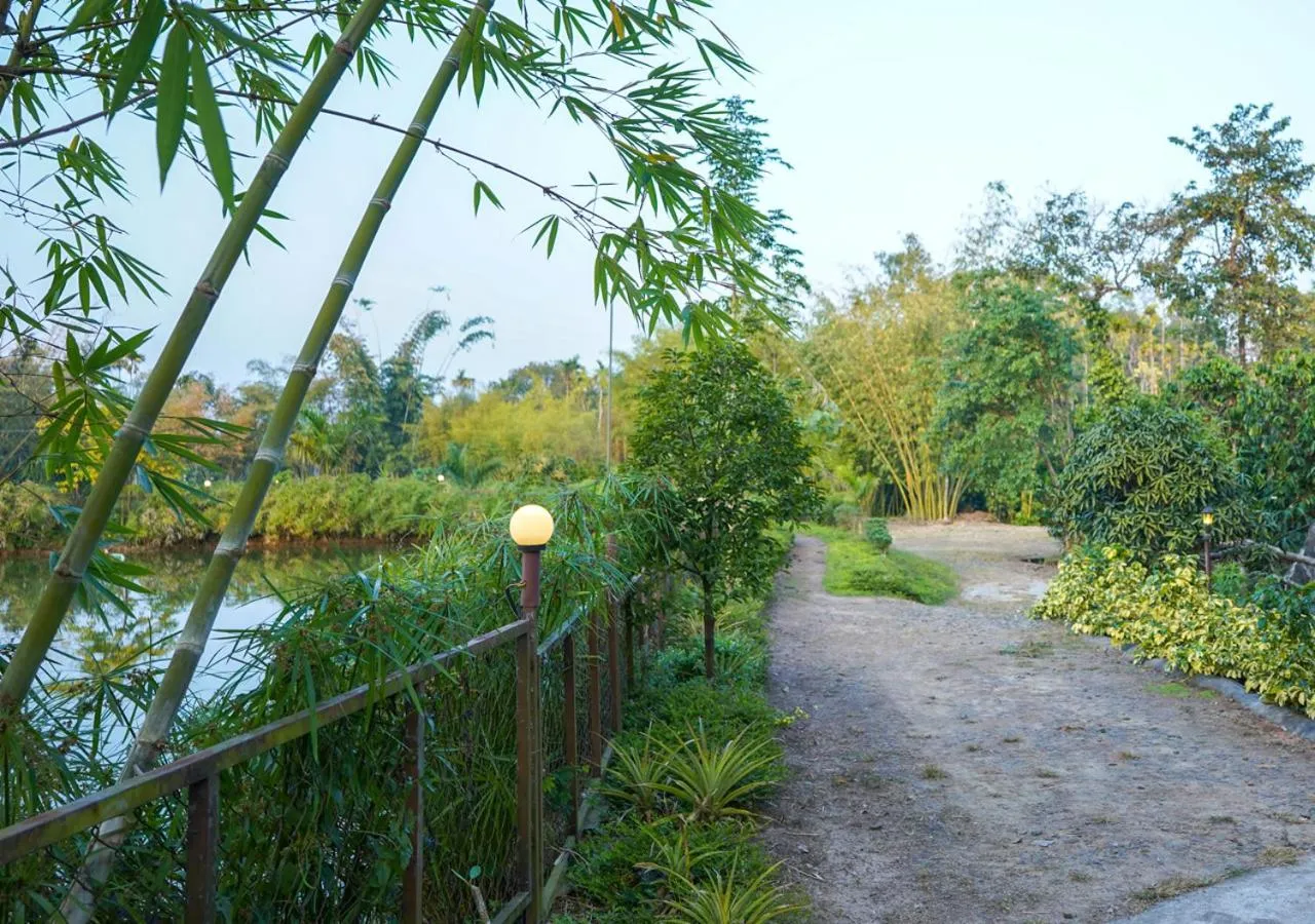 Facade/entrance in Niyatma Wayanad Pool Resort by VOYE HOMES - Inside Coffee Plantation