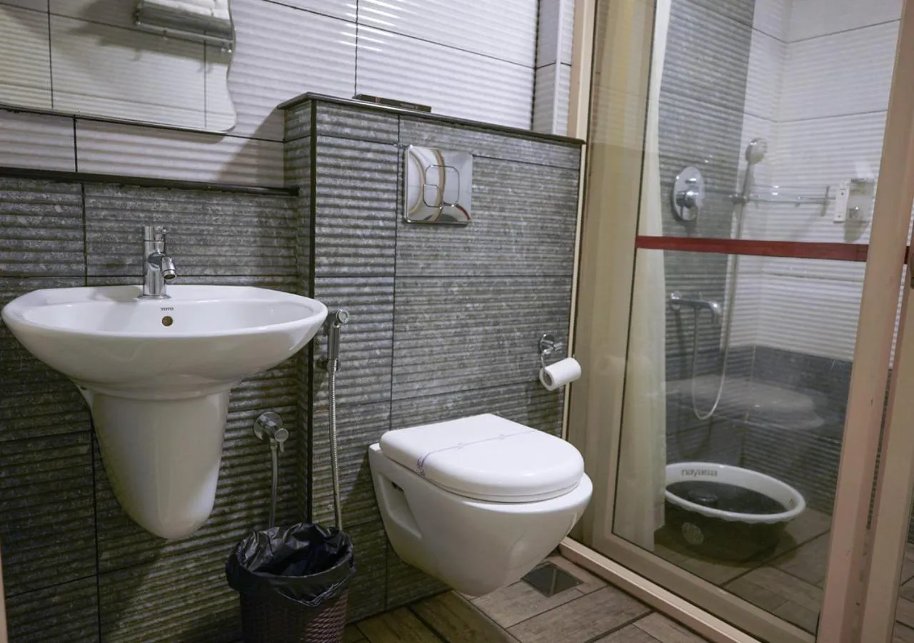 Shower in Niyatma Wayanad Pool Resort by VOYE HOMES - Inside Coffee Plantation