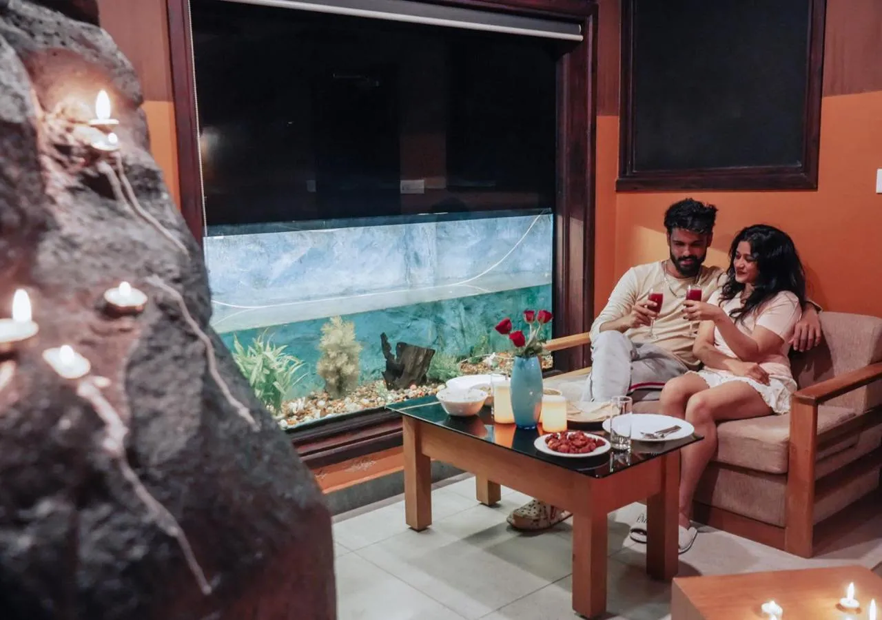 Seating area in Niyatma Wayanad Pool Resort by VOYE HOMES - Inside Coffee Plantation