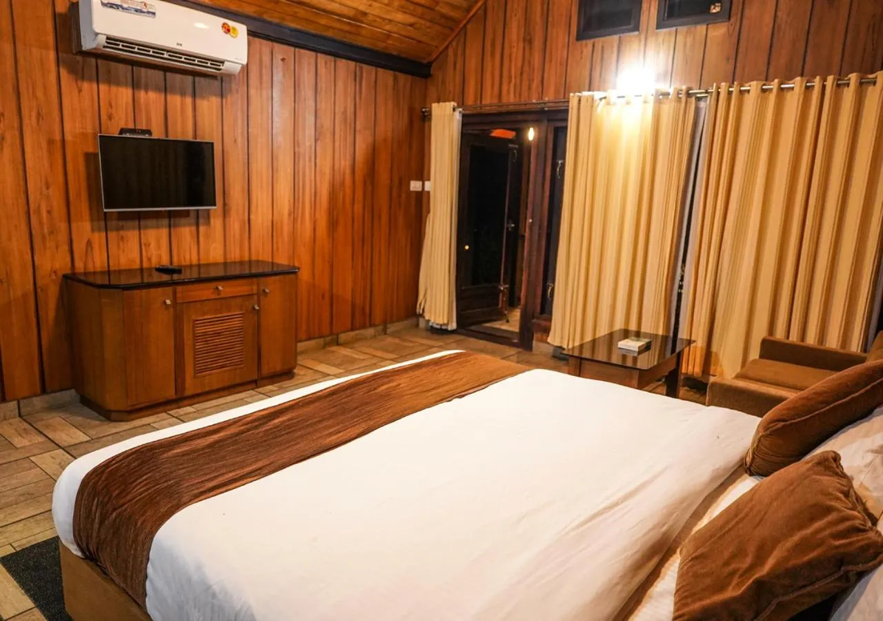 Bedroom, Bed in Niyatma Wayanad Pool Resort by VOYE HOMES - Inside Coffee Plantation