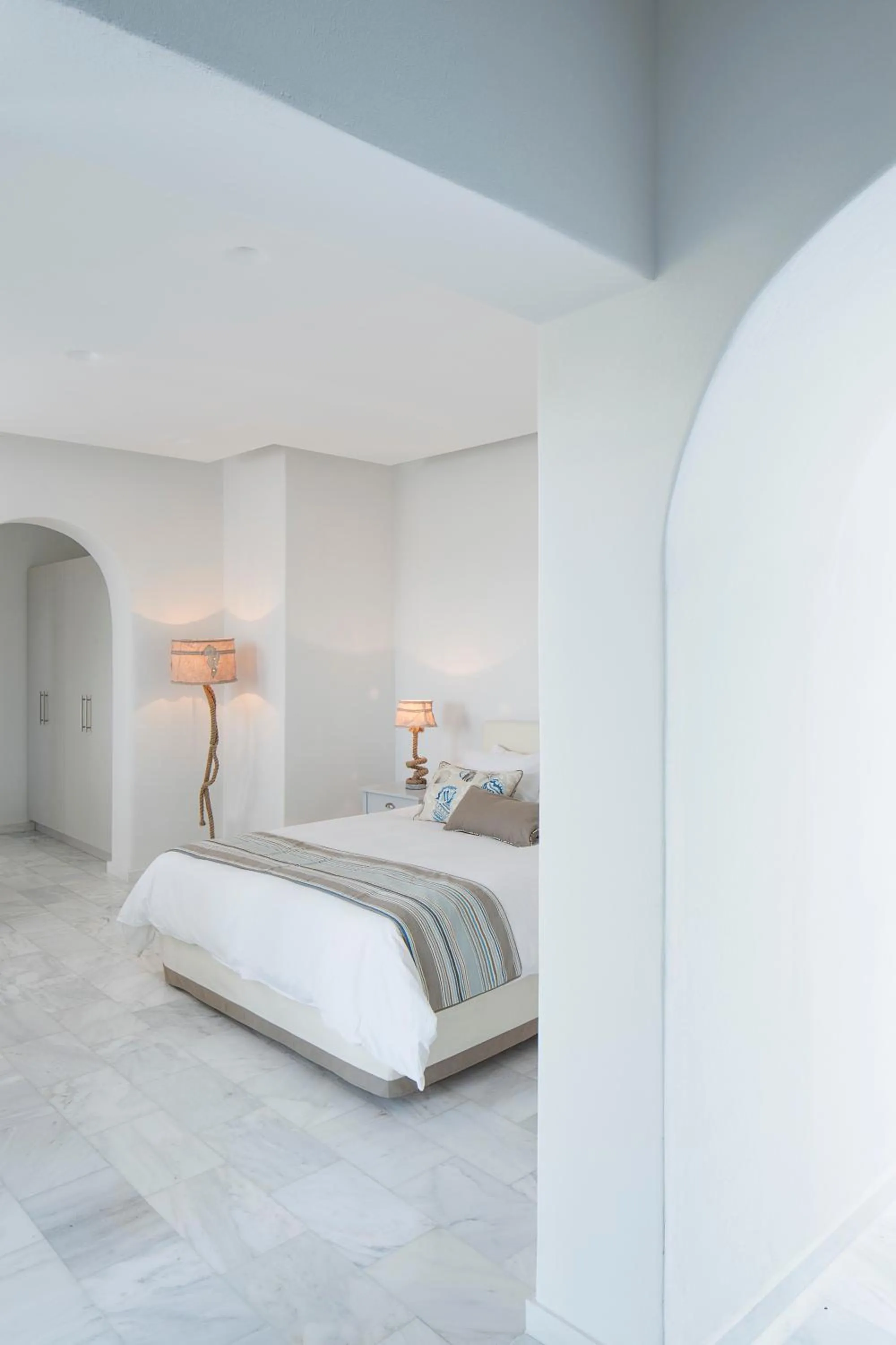 Bed in Poseidon of Paros Hotel & Spa