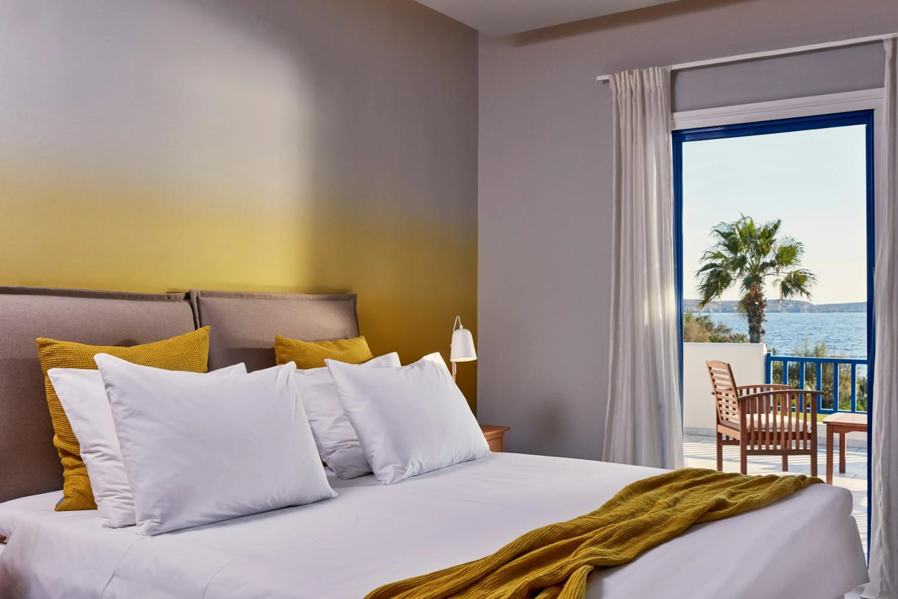 Bed in Poseidon of Paros Hotel & Spa