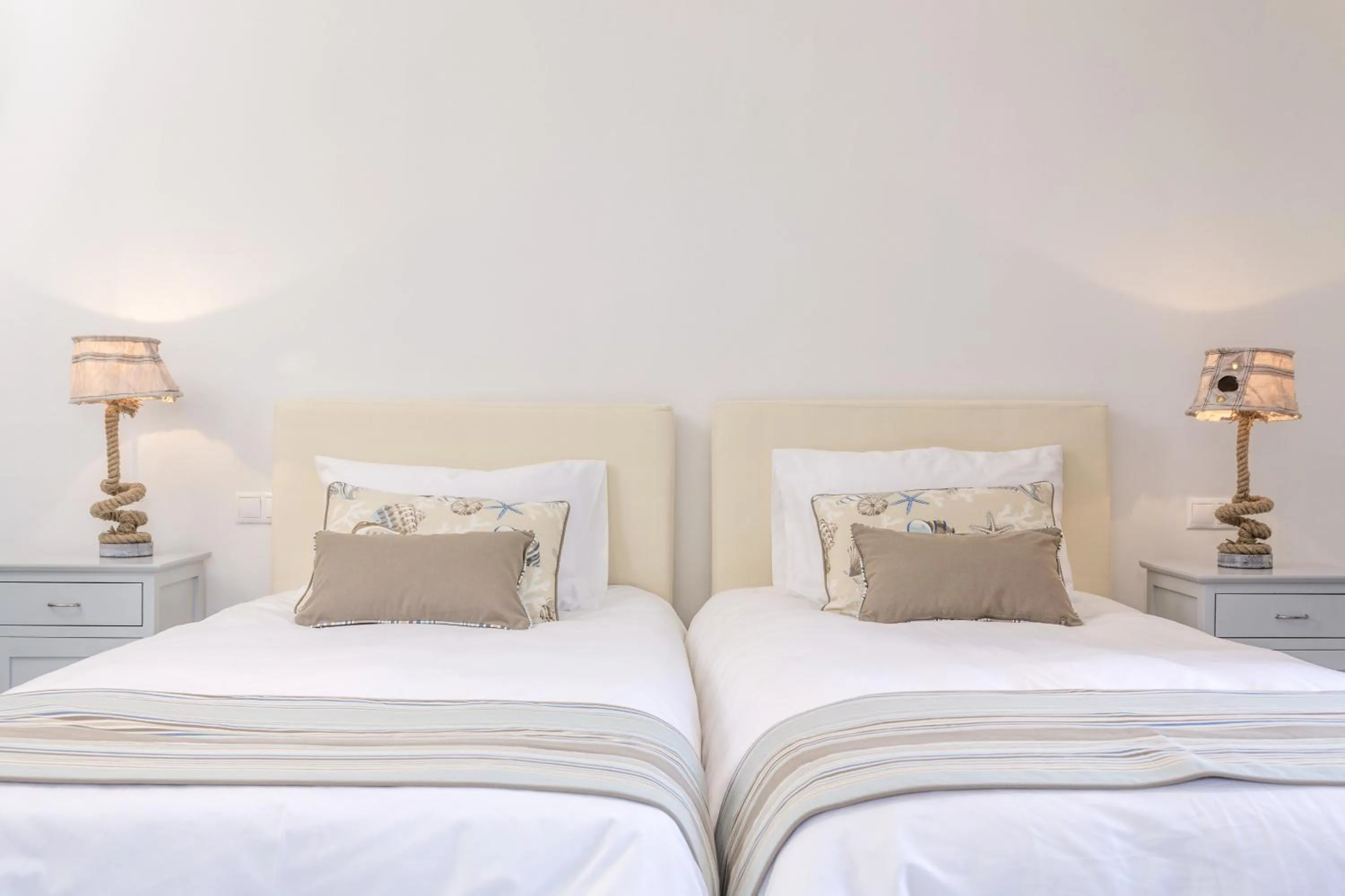 Bed in Poseidon of Paros Hotel & Spa