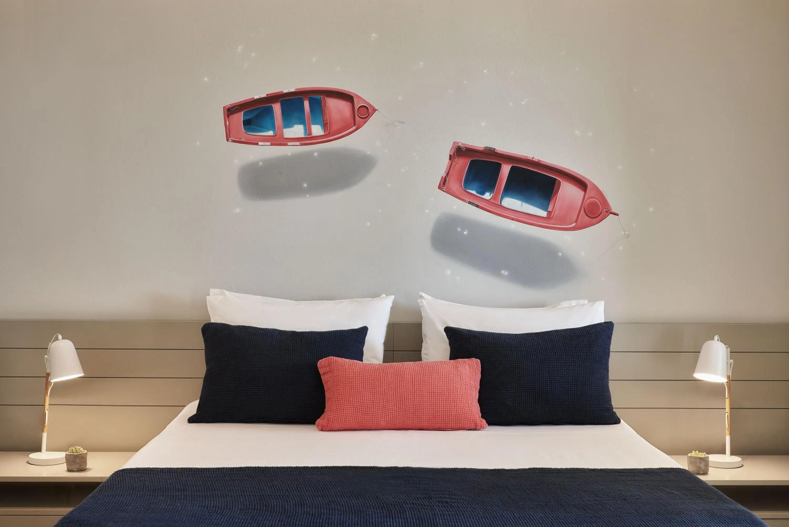 Bed in Poseidon of Paros Hotel & Spa