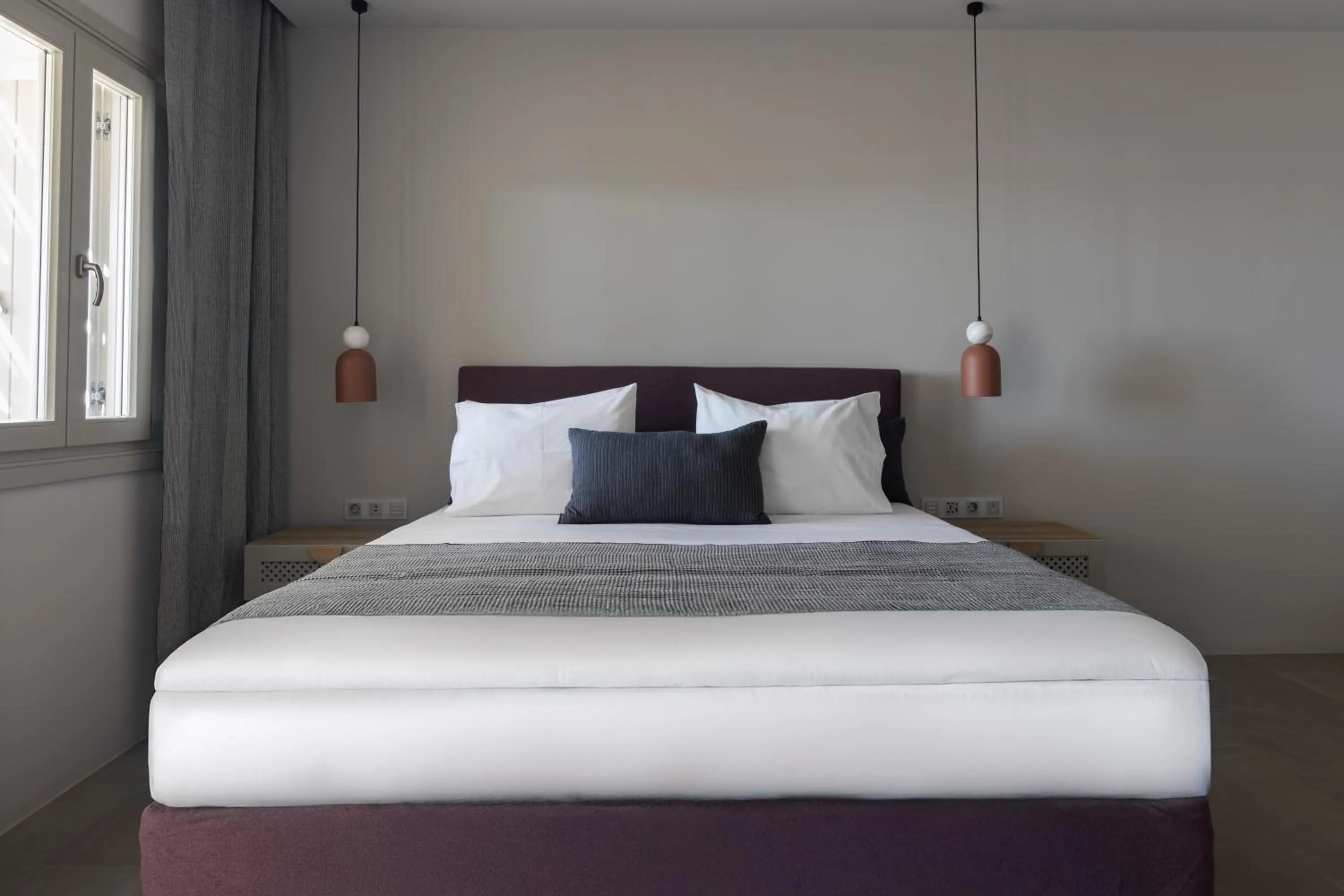 Bed in Poseidon of Paros Hotel & Spa