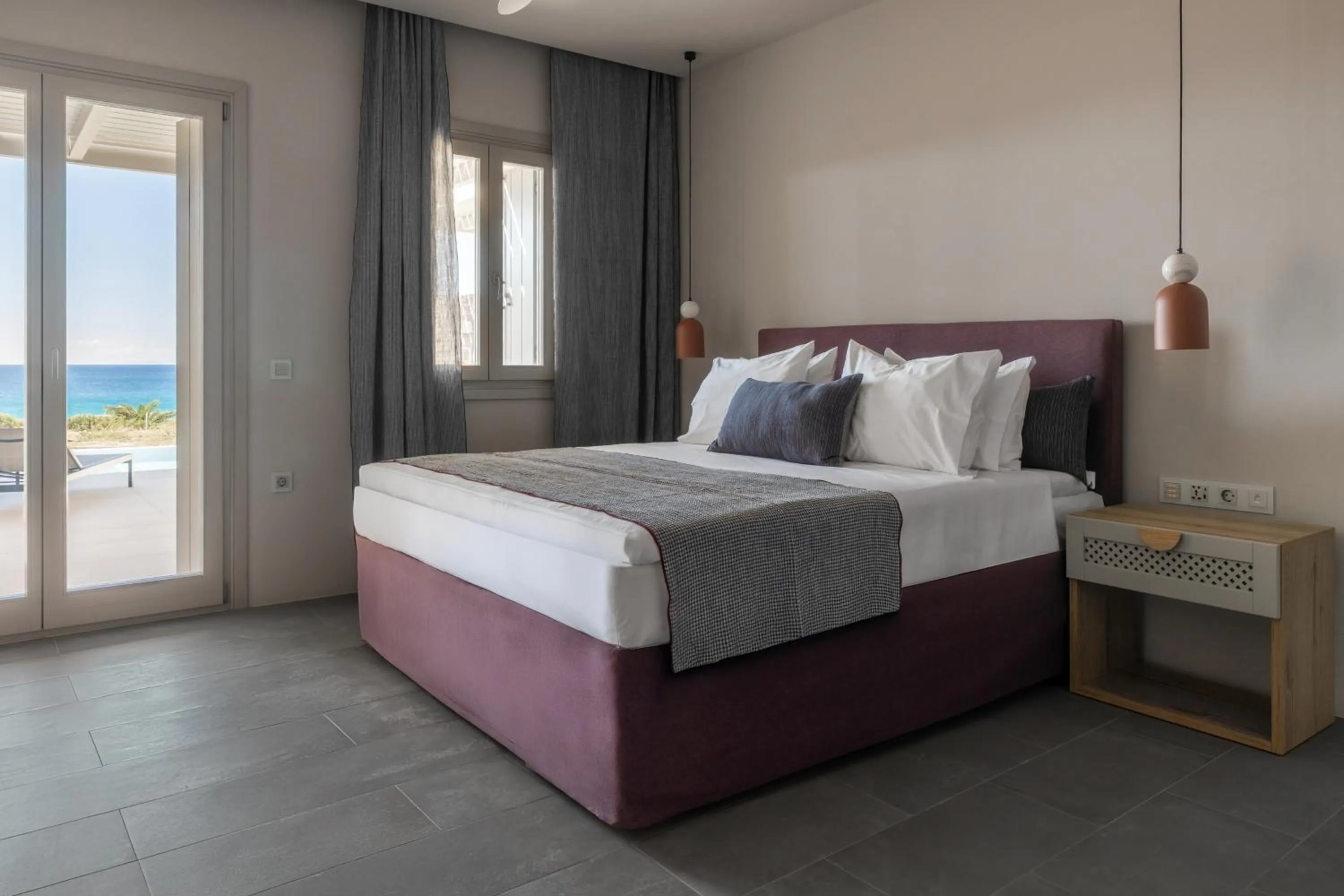 Bed in Poseidon of Paros Hotel & Spa