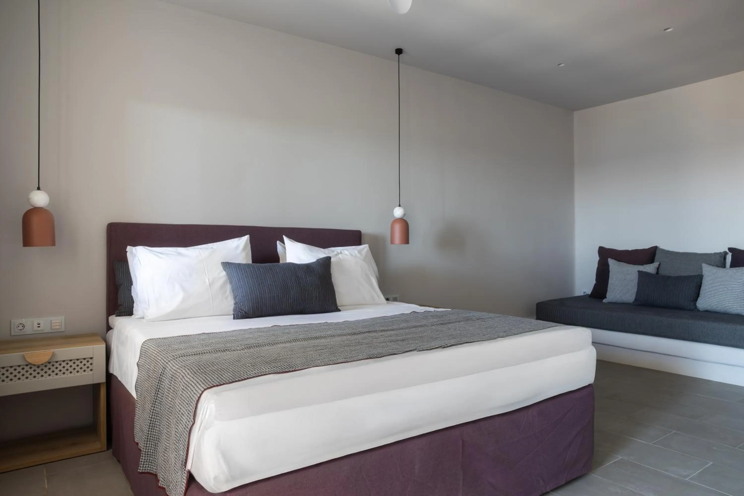Bed in Poseidon of Paros Hotel & Spa