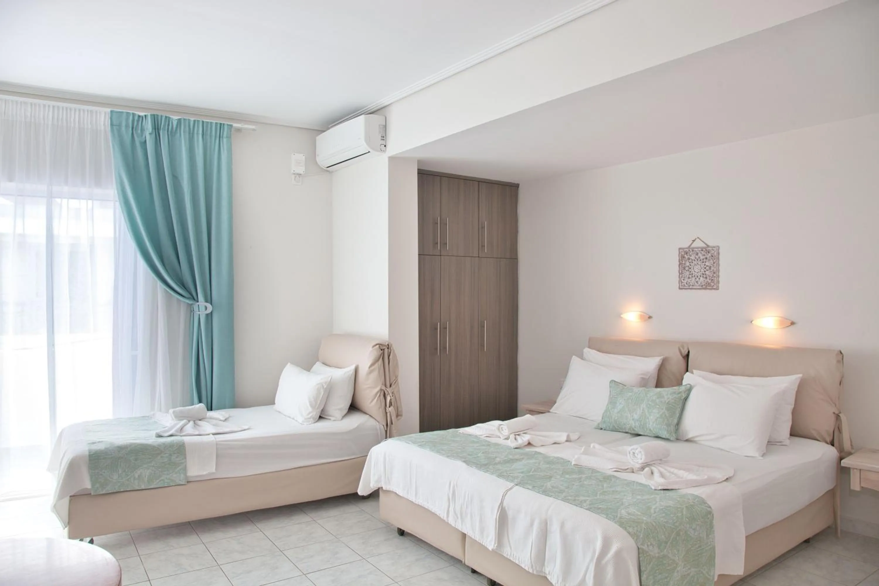 Photo of the whole room, Bed in The Milos