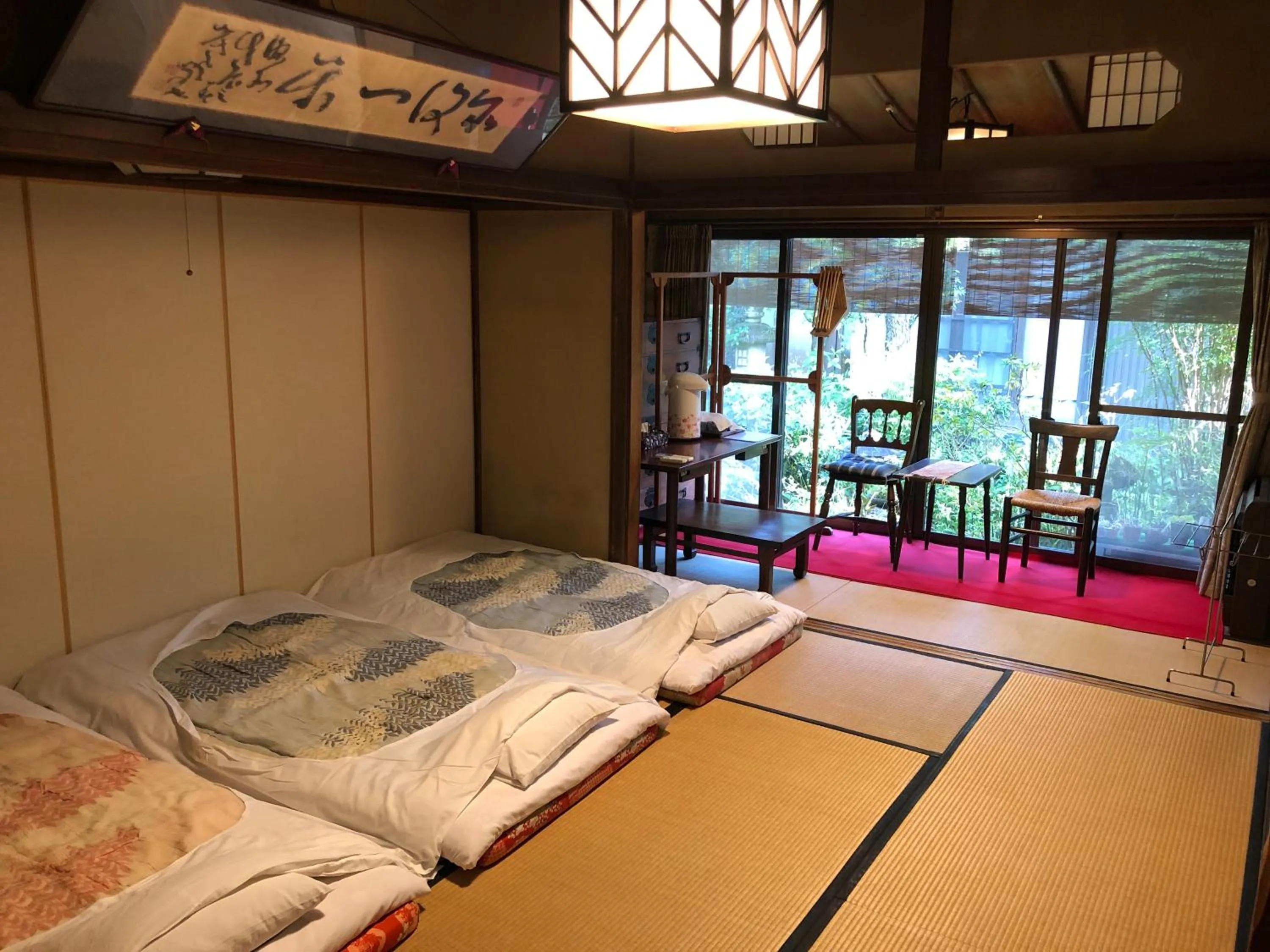 Photo of the whole room, Bed in Kappo Ryokan Uoichi