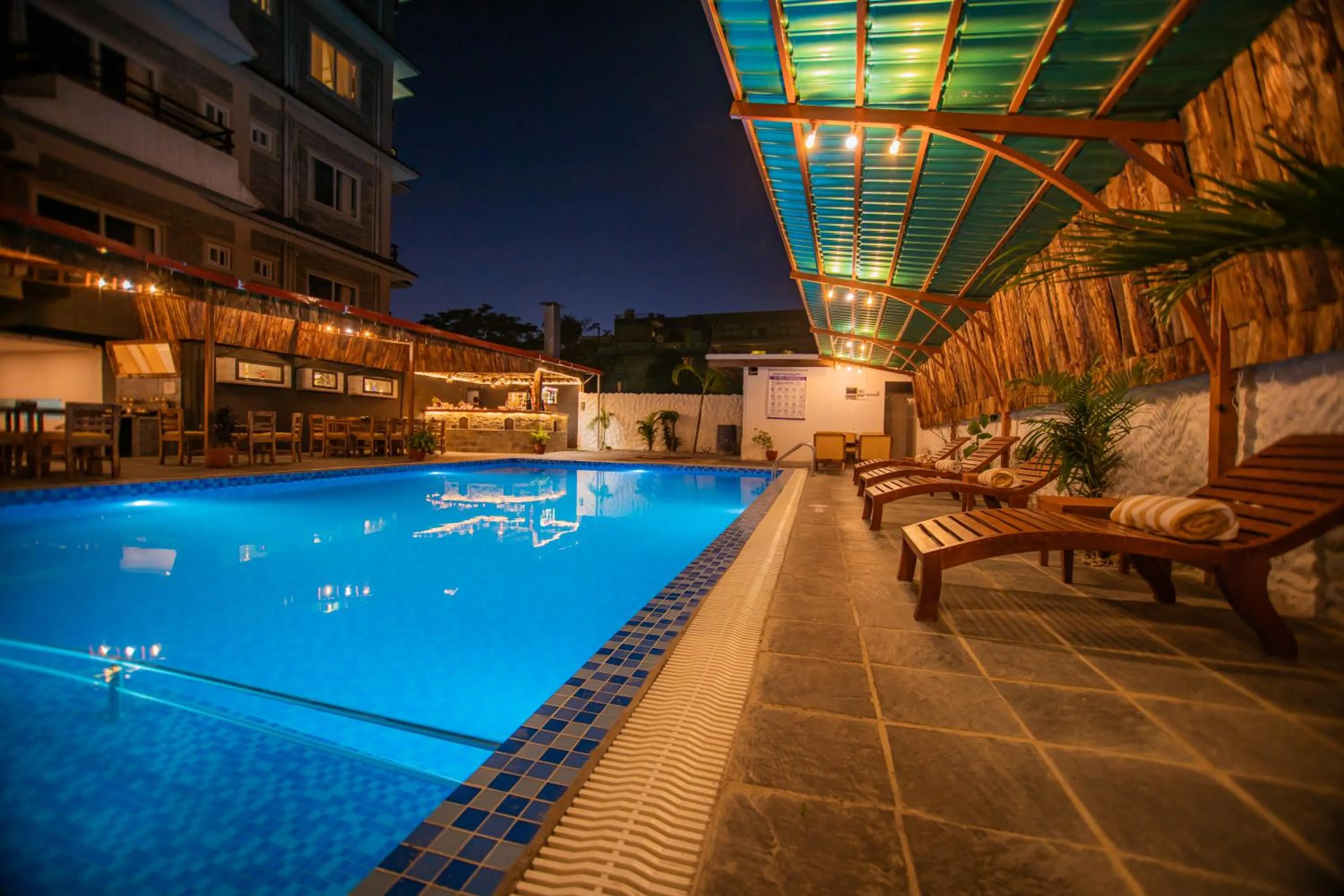 Swimming pool in Majheri Resort and Spa