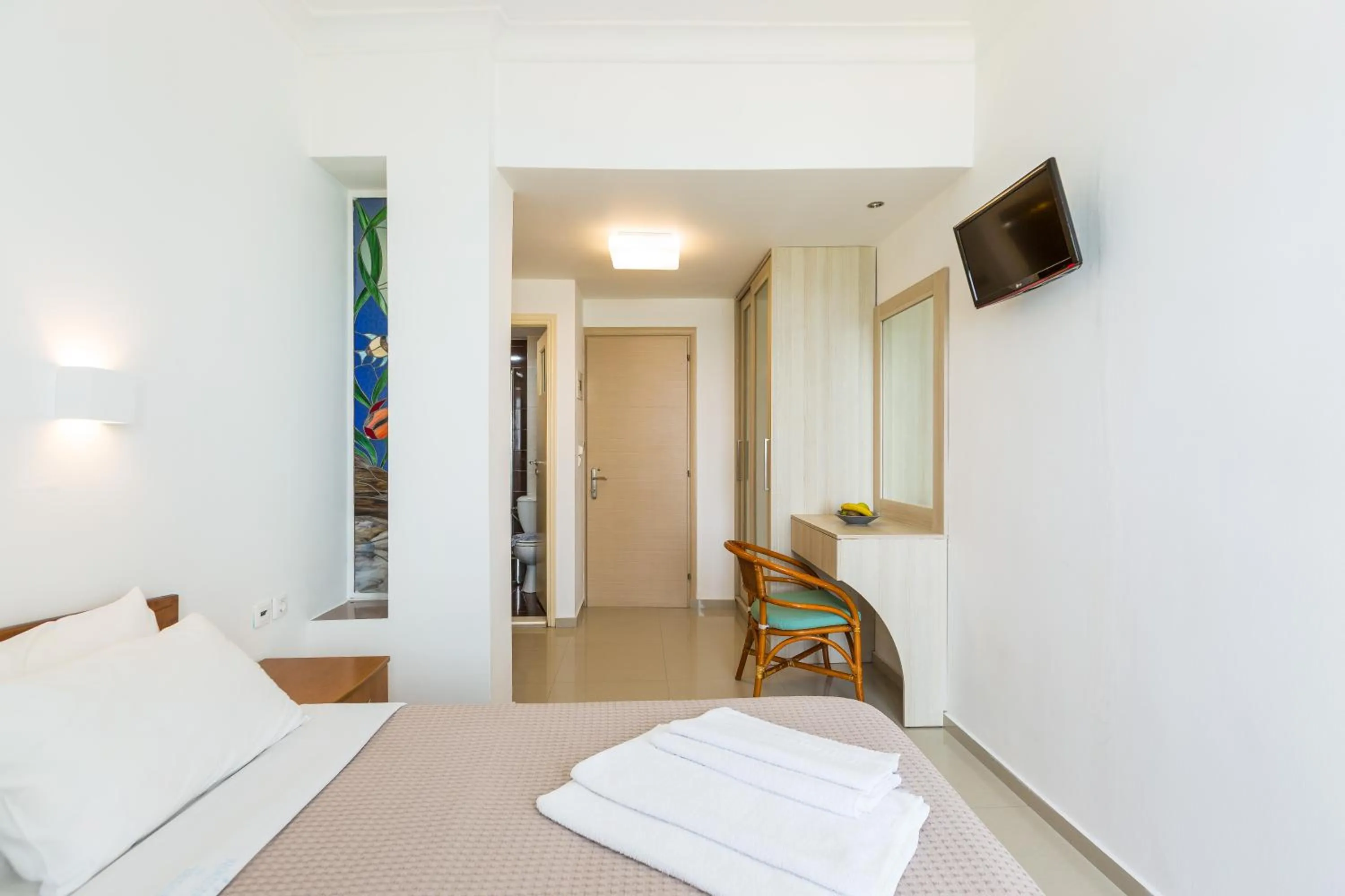 Bed in Poseidon Hotel