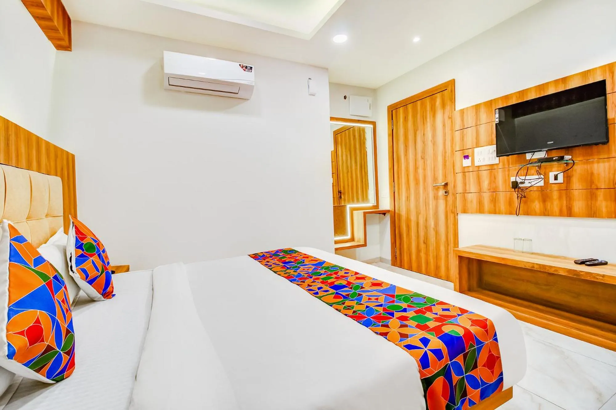 Bed in FabHotel Prime Purple Orchid