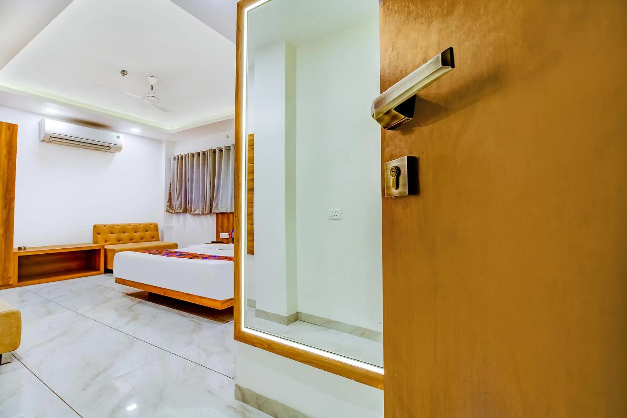 Bed in FabHotel Prime Purple Orchid