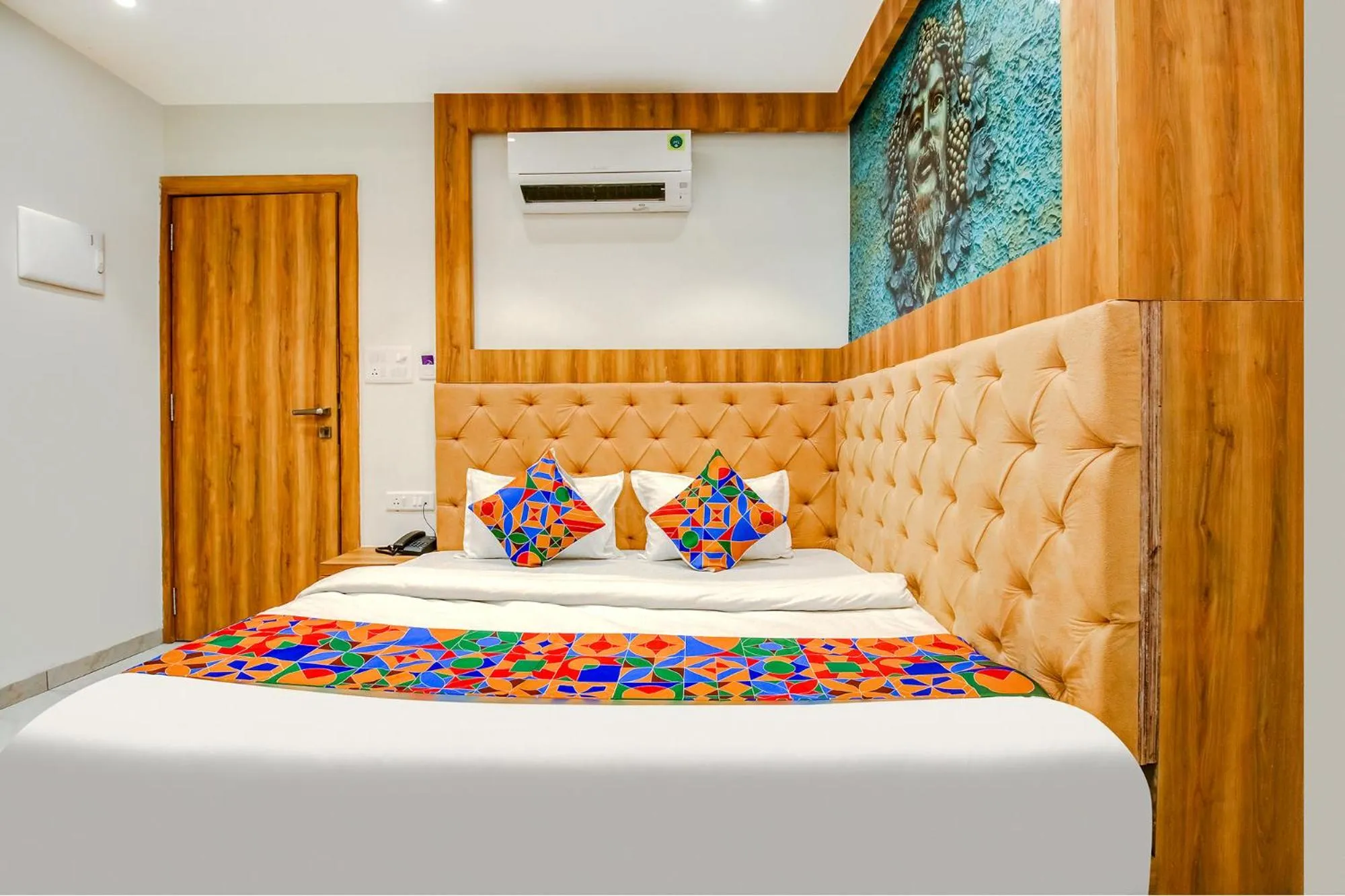 Bed in FabHotel Prime Purple Orchid