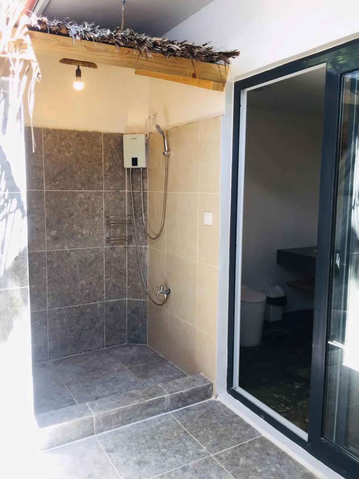 Shower in Treeshade Resort & Spa Moalboal