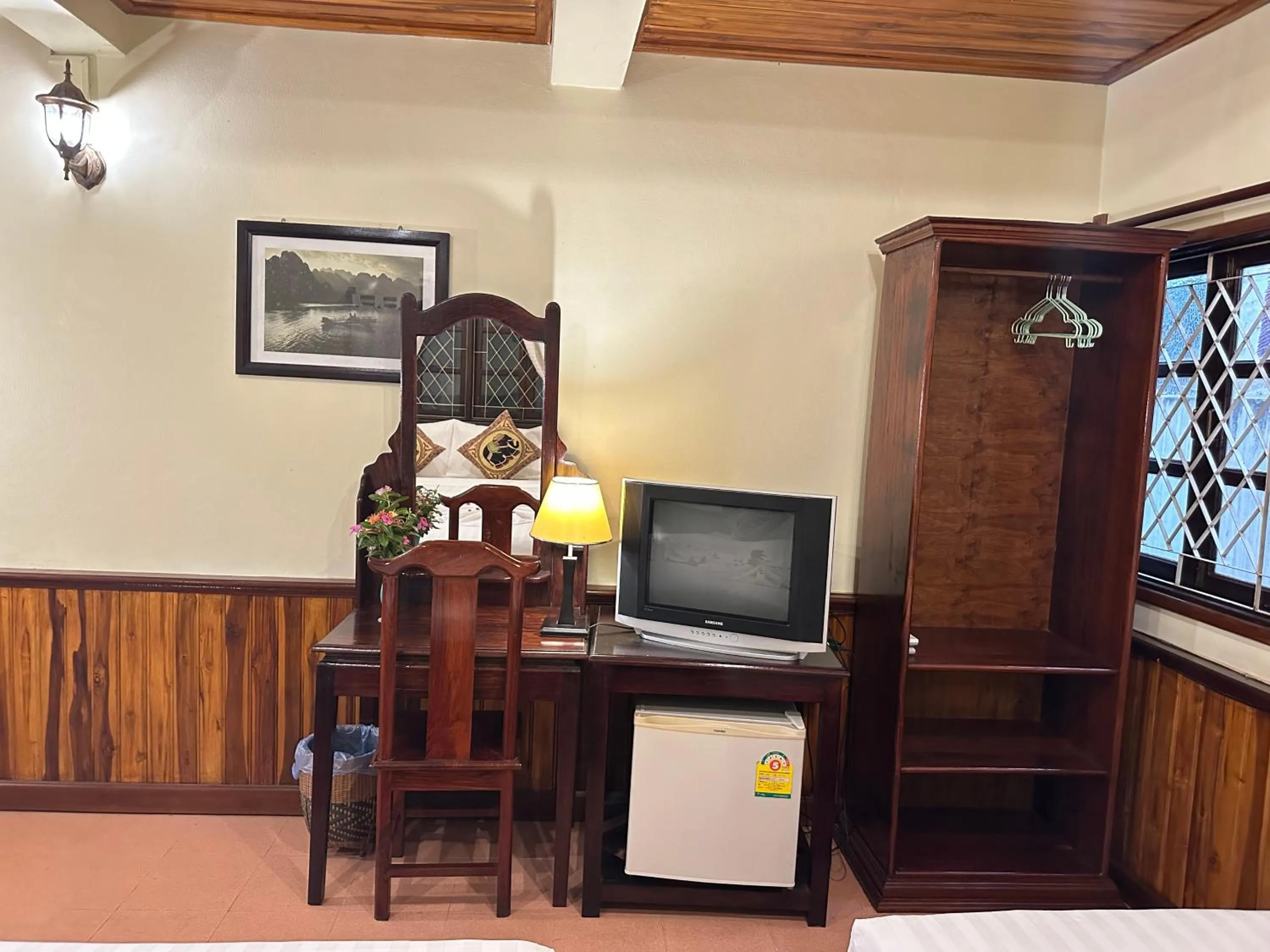 Communal lounge/ TV room in Villa Alounsavath Mekong Riverside