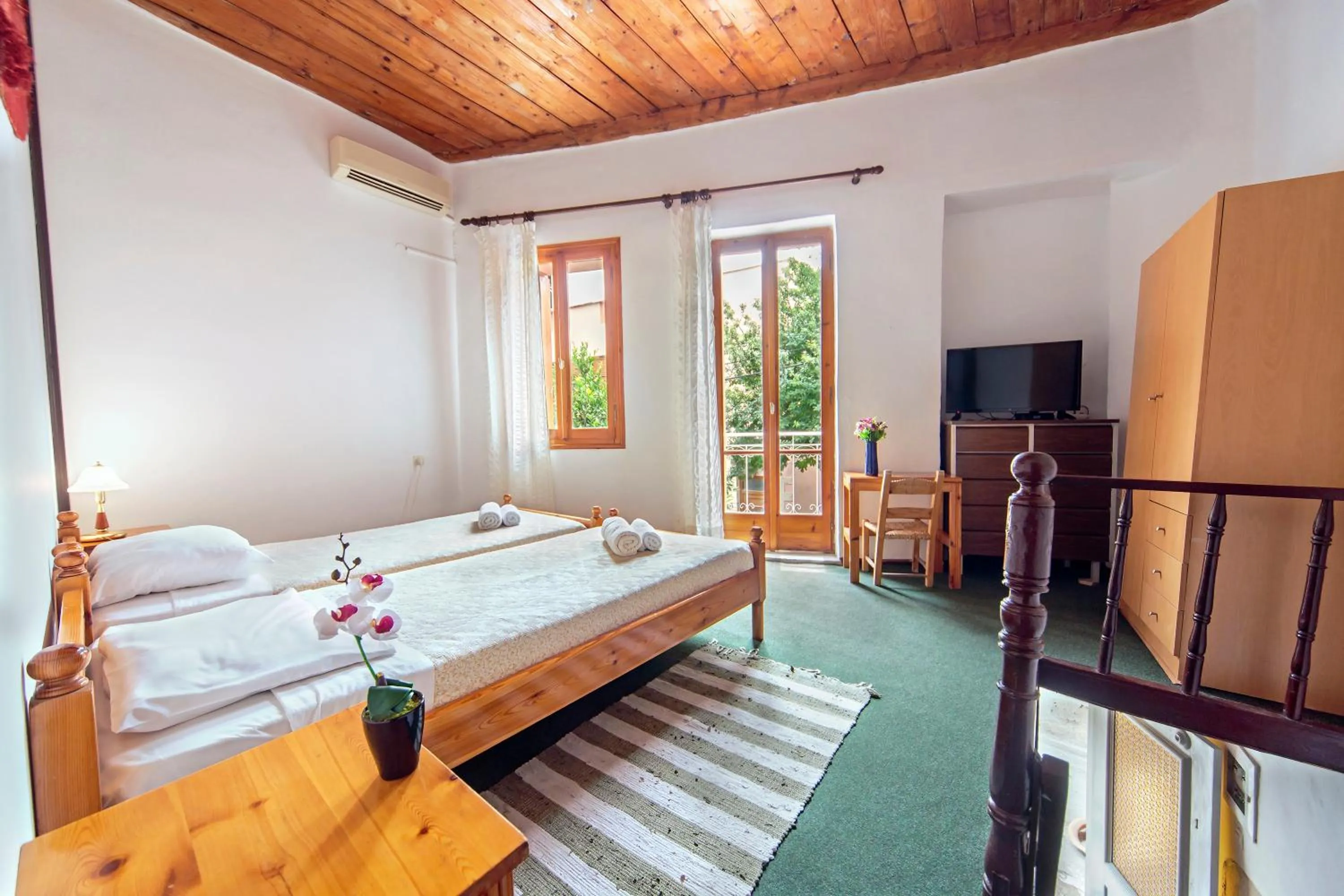 Bedroom in KasteliSuites