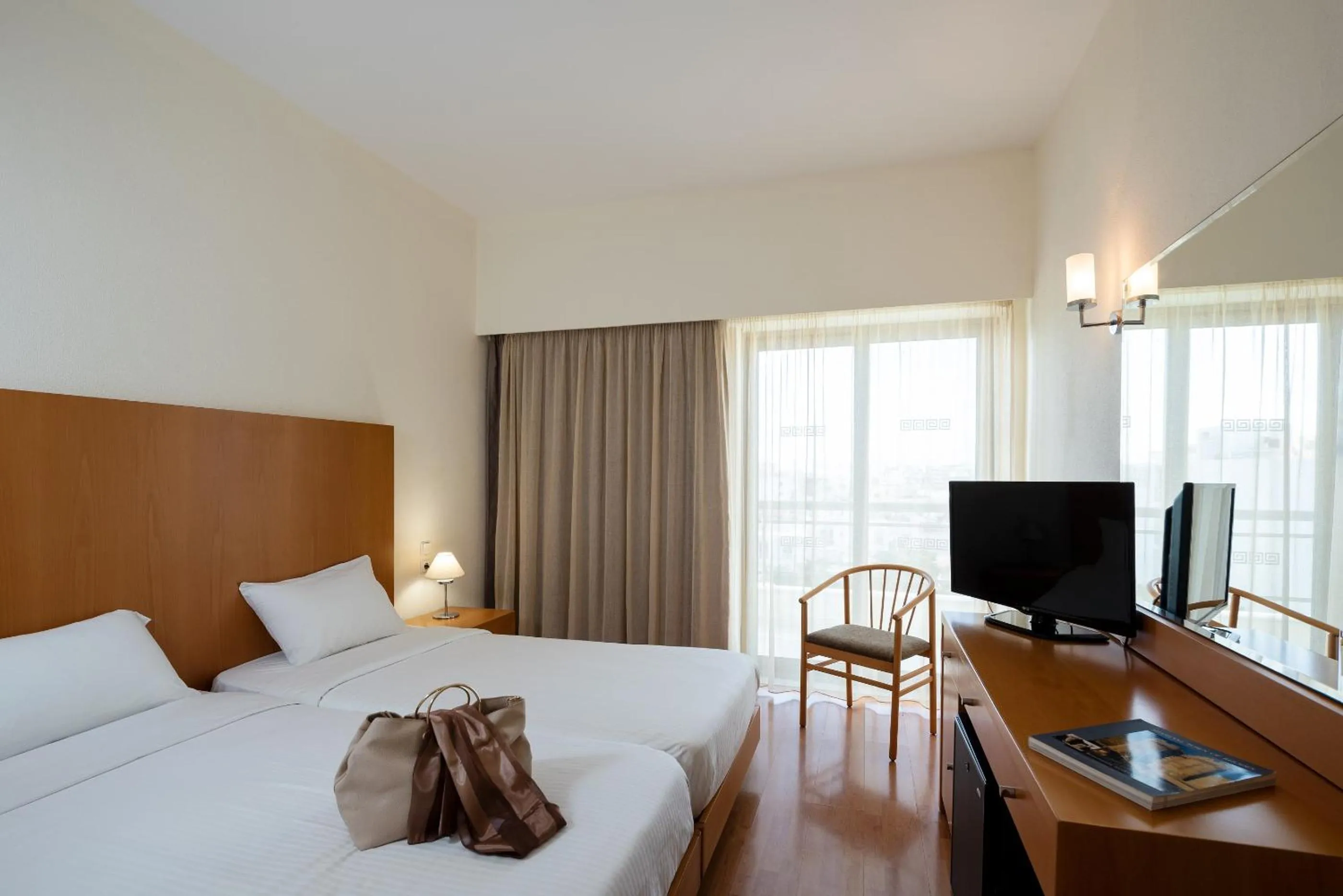 Photo of the whole room, Bed in Angela Downtown Hotel