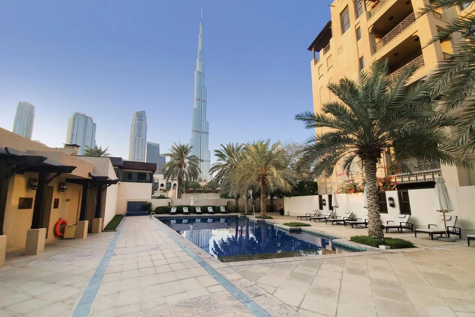 Pool view in Manzil - Cozy 2BR Penthouse with Private Terrace and Full Burj View in Downtown