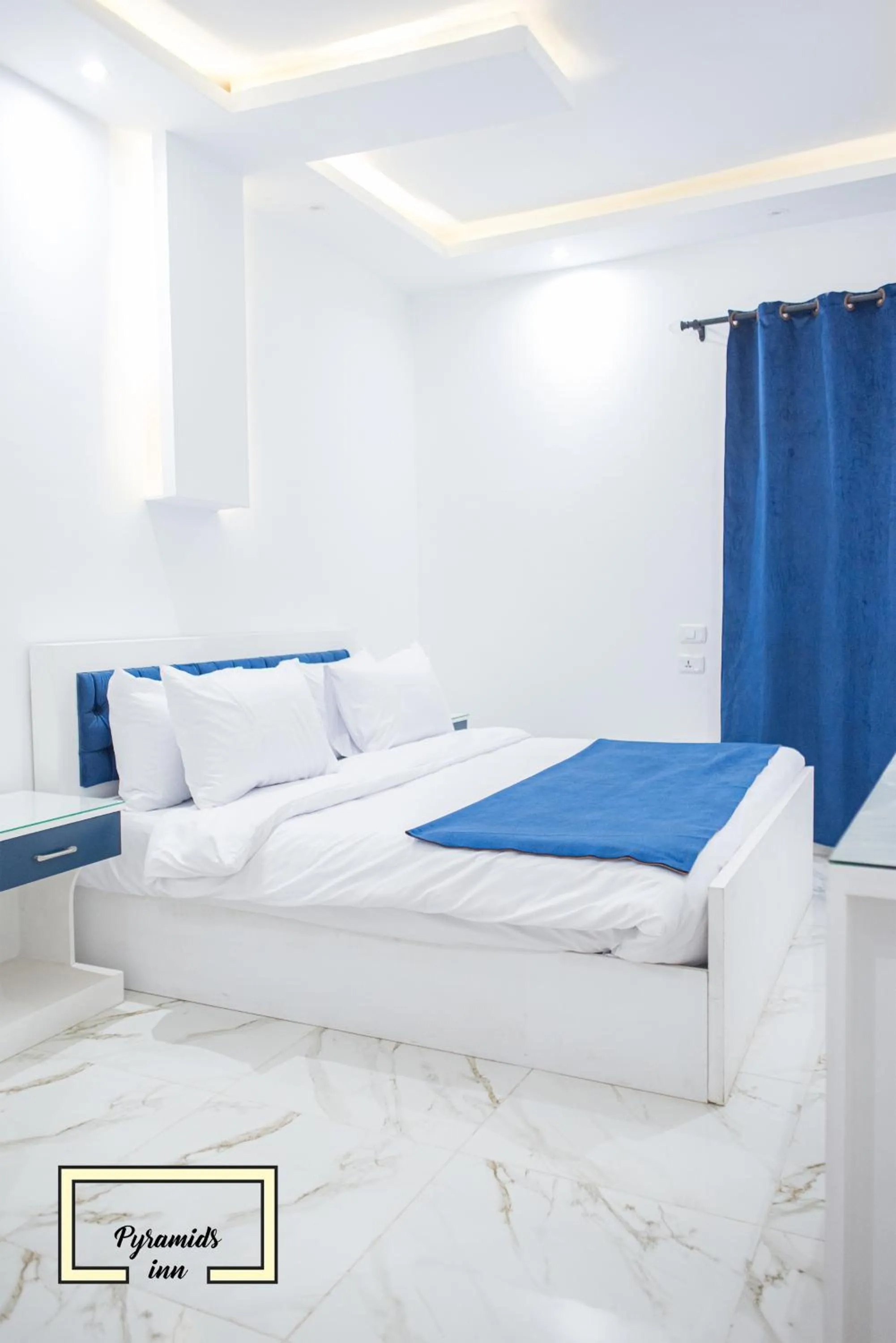 Bedroom in PR Pyramids Inn