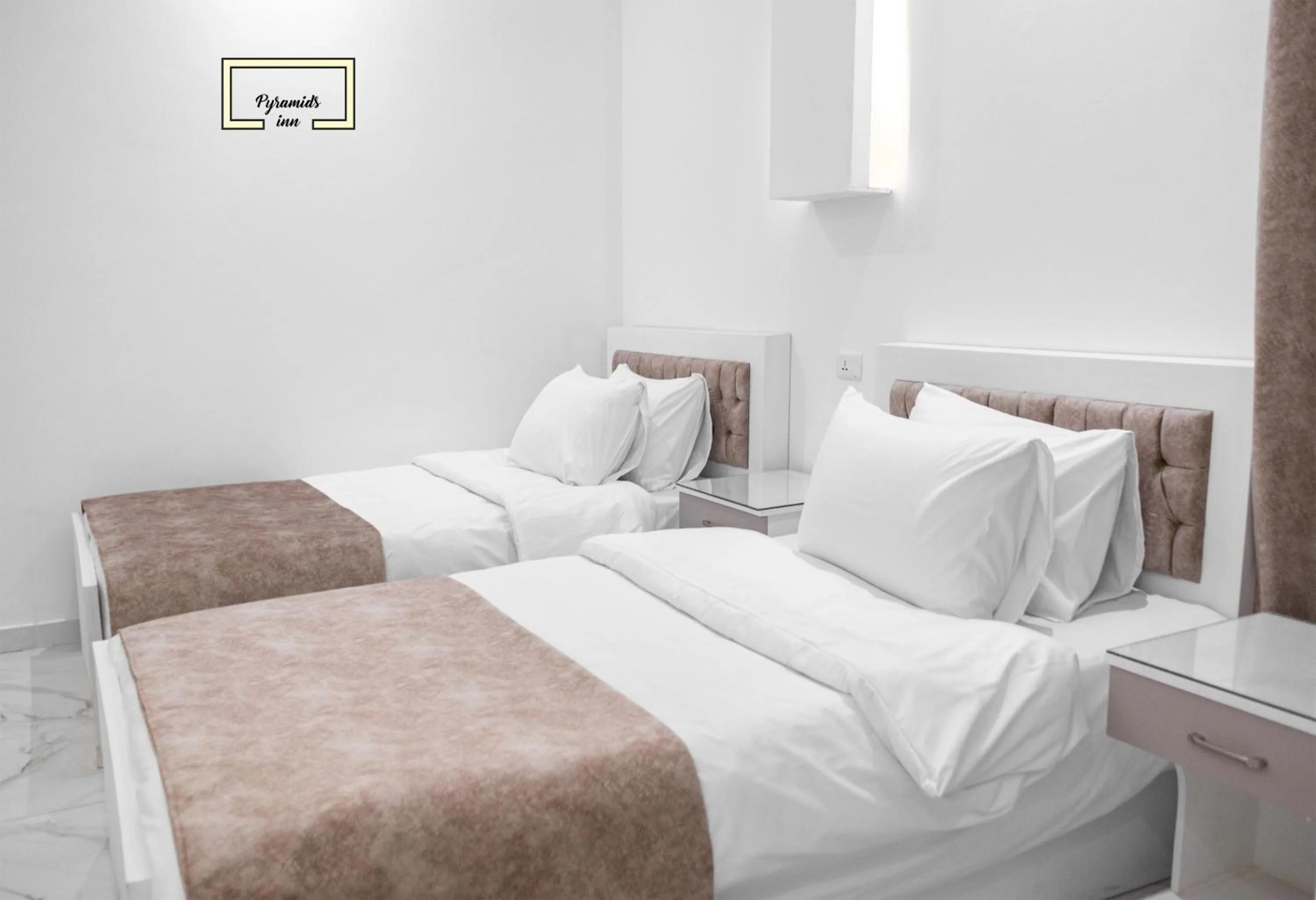 Bedroom in PR Pyramids Inn