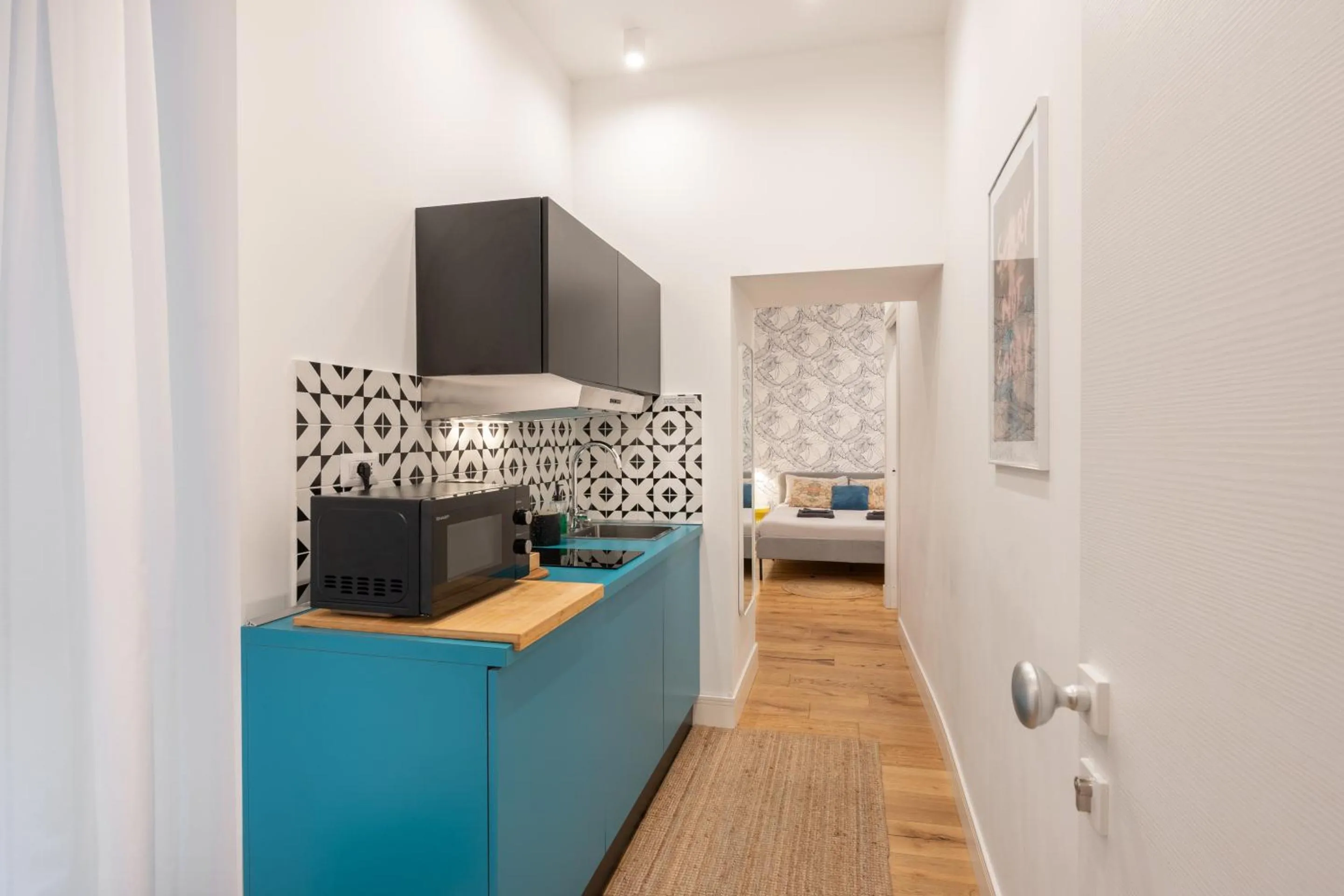 Kitchen or kitchenette, Bed in The Idyll Boutique apartment - Suite in Napoli's Spanish Quarters