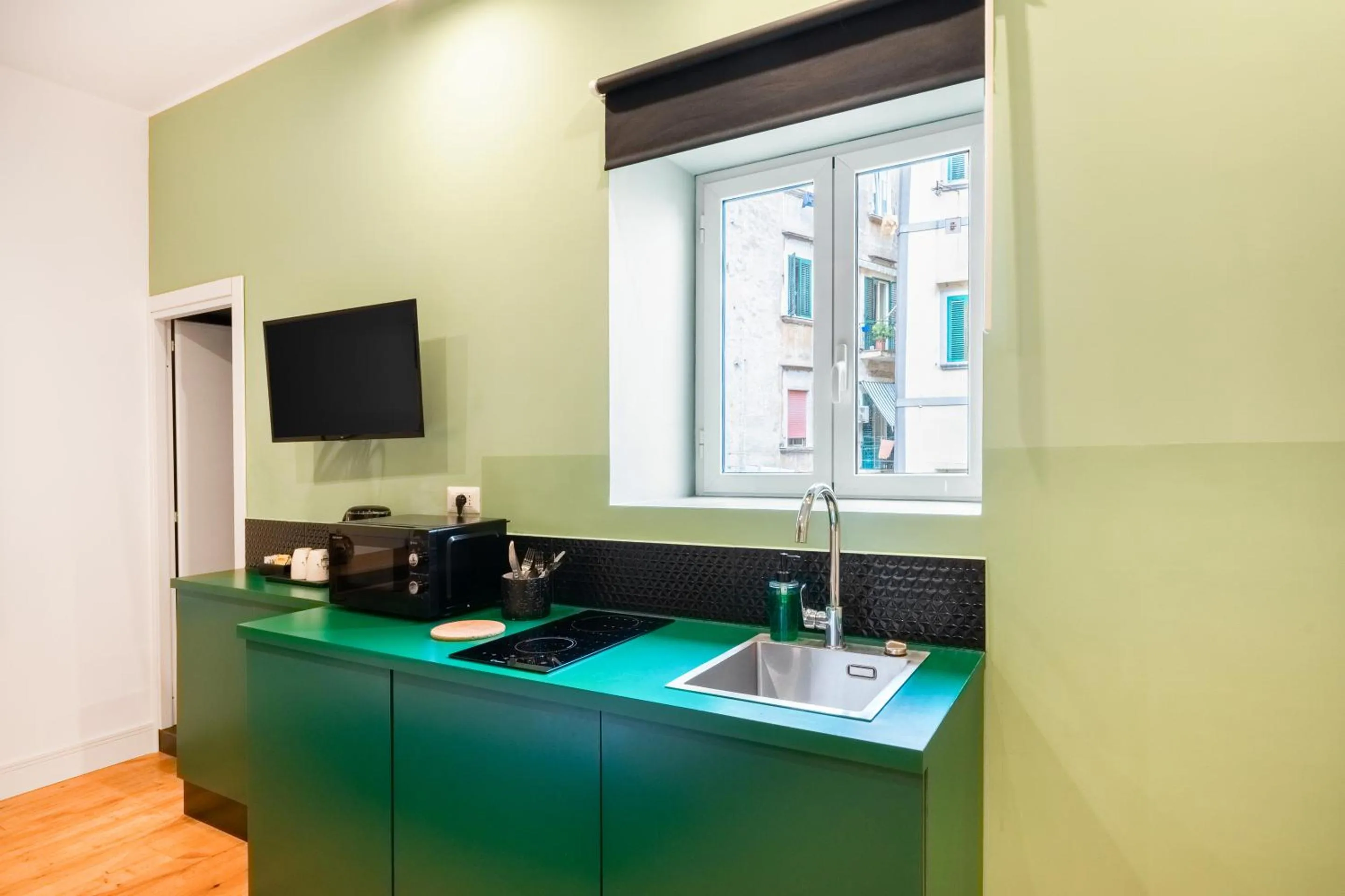 Kitchen or kitchenette in The Idyll Boutique apartment - Suite in Napoli's Spanish Quarters